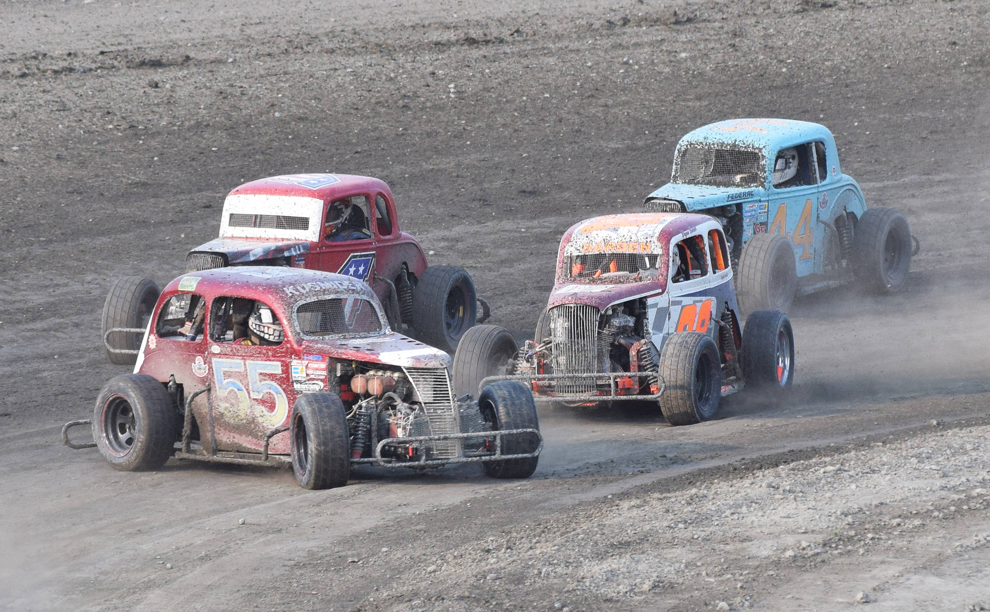 The #55 Legends car of David Kusmider spins in front of the field Saturday, June 29, 2019, at Twin Cities Raceway in Kenai, Alaska. (Photo by Joey Klecka/Peninsula Clarion)