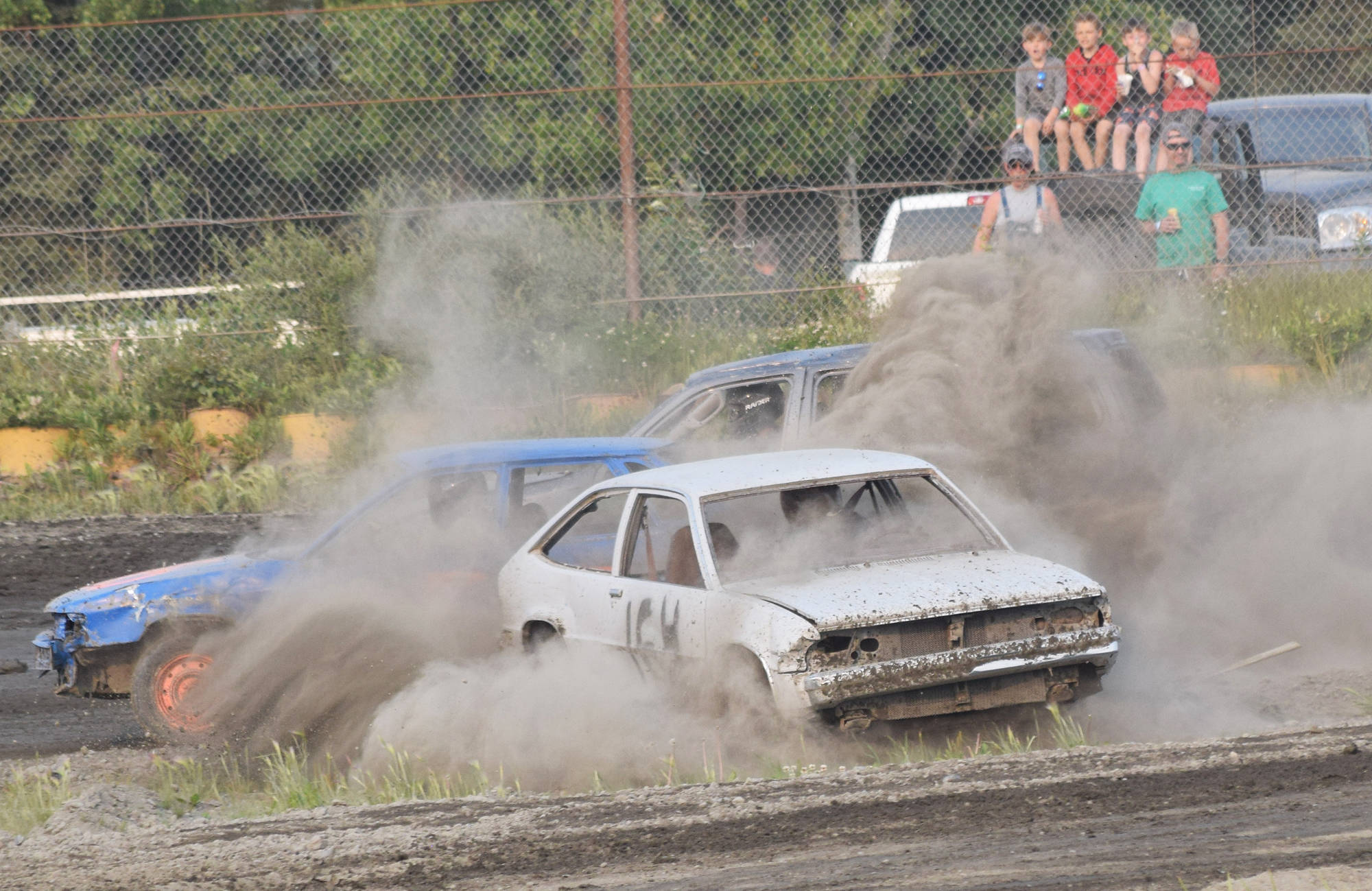 A driver spins out in the second Dollar Stock heat race Saturday, June 29, 2019, at Twin Cities Raceway in Kenai, Alaska. (Photo by Joey Klecka/Peninsula Clarion)