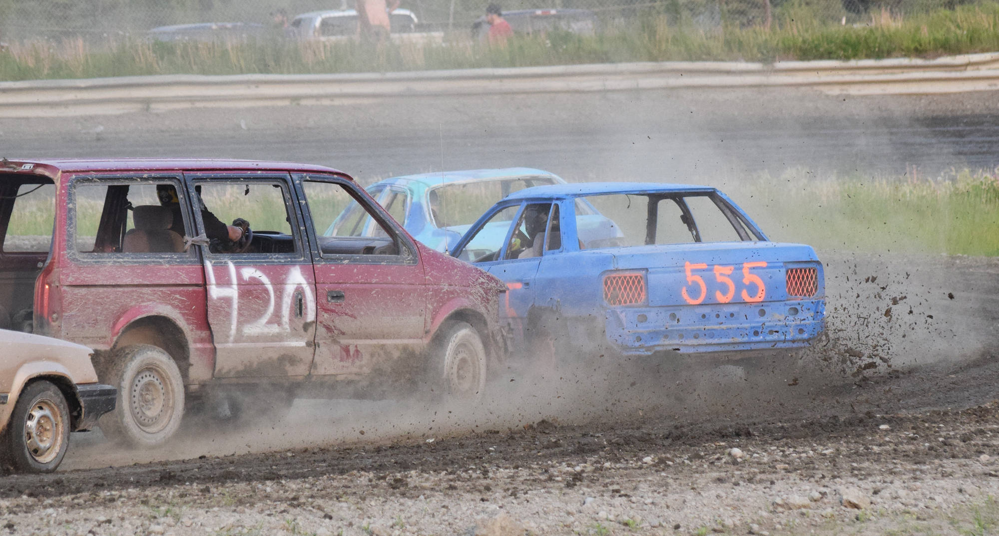Brick Marcorelle in the #420 van spins out the driver of the #555 car in the Dollar Stock feature race Saturday, June 29, 2019, at Twin Cities Raceway in Kenai, Alaska. (Photo by Joey Klecka/Peninsula Clarion)