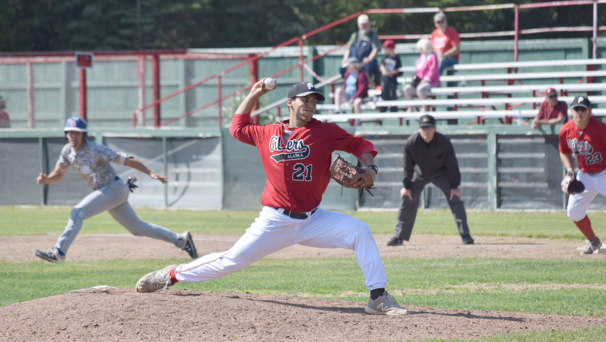 Peninsula Oilers reliever Giancarlos Servin delivers to the Anchorage Glacier Pilots on Sunday, June 30, 2019, at Coral Seymour Memorial Park in Kenai, Alaska. (Photo by Jeff Helminiak/Peninsula Clarion)