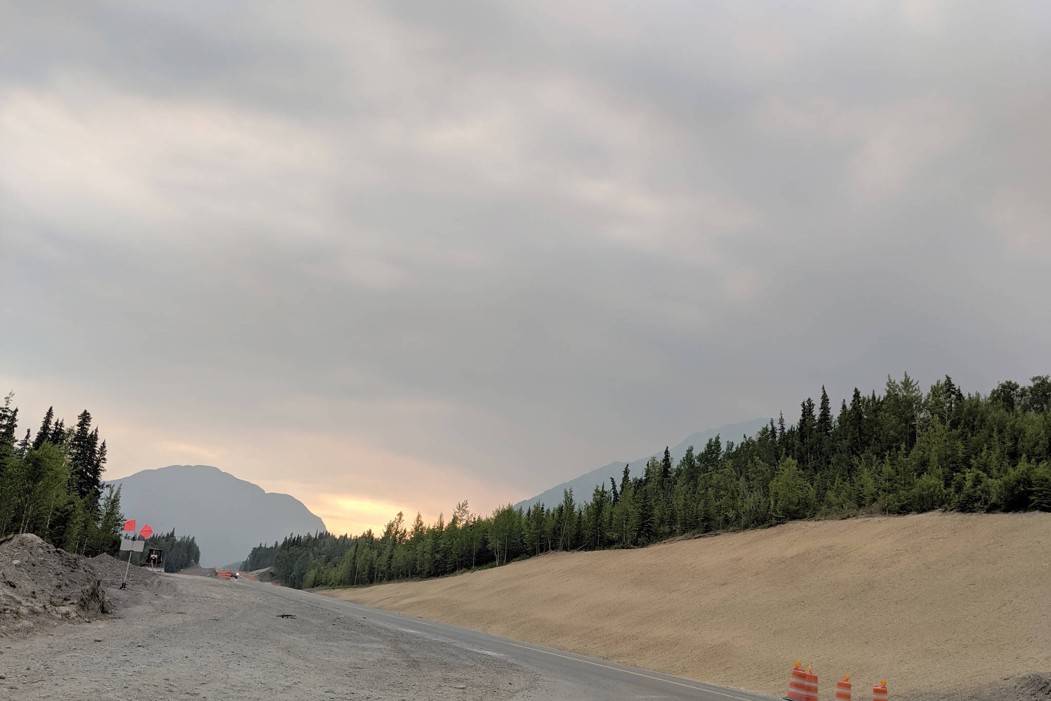 The glow from the Swan Lake Fire can be seen on the horizon from the east entrance of Skilak Lake Road on Sunday, June 23, 2019. The Swan Lake Fire, located just north of Sterling, Alaska, grew to 32,300 acres over the weekend. (Photo by Erin Thompson/Peninsula Clarion)