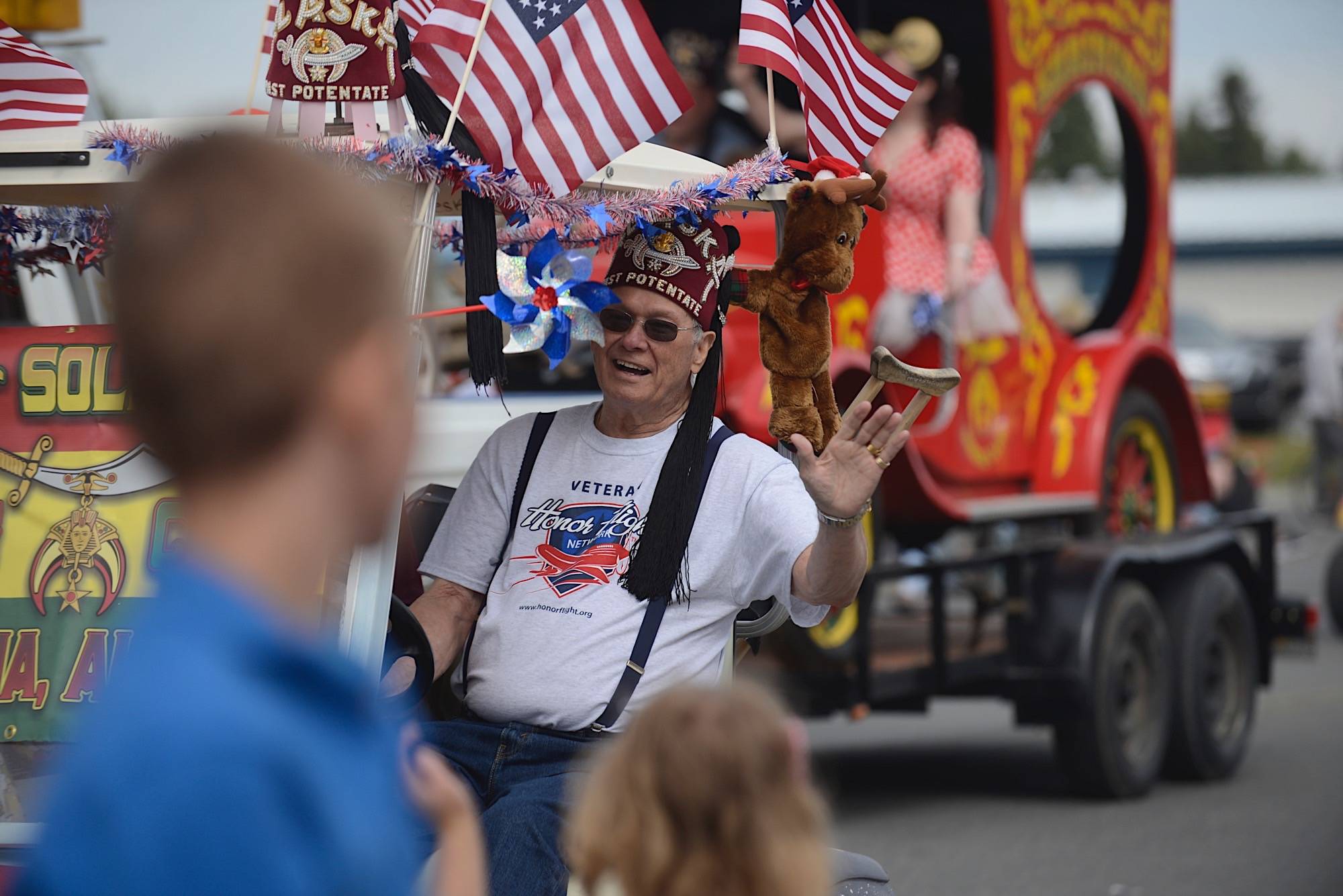 A man waves during the 2019 Kenai 4th of July Parade in Kenai, Alaska. (Clarion file)