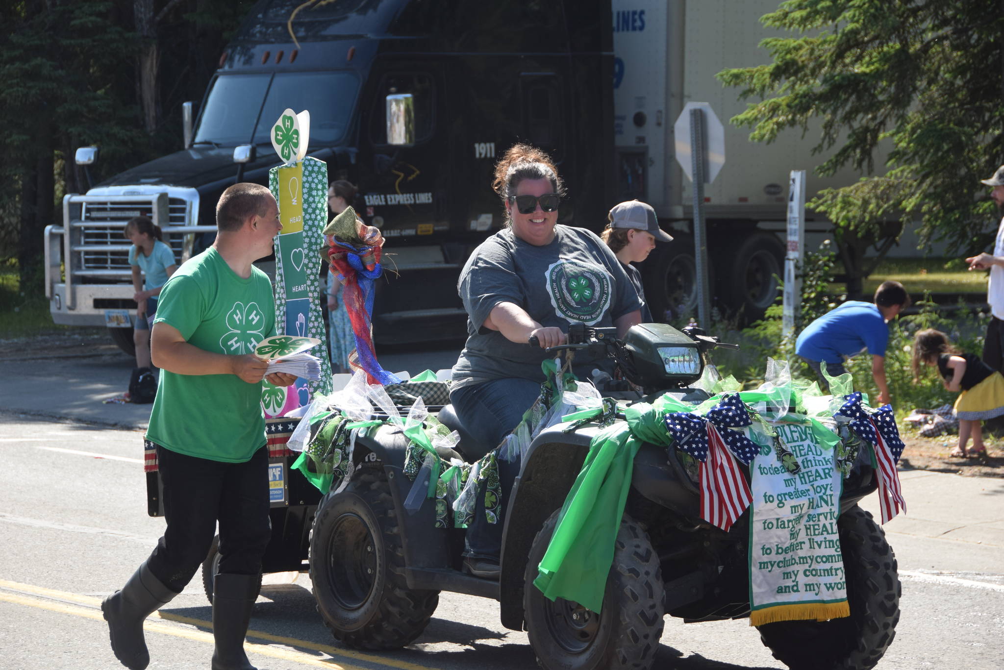 Volunteers with the local 4-H Chapter share a laugh during the July 4th parade in Kenai, Alaska. (Photo by Brian Mazurek/Peninsula Clarion)