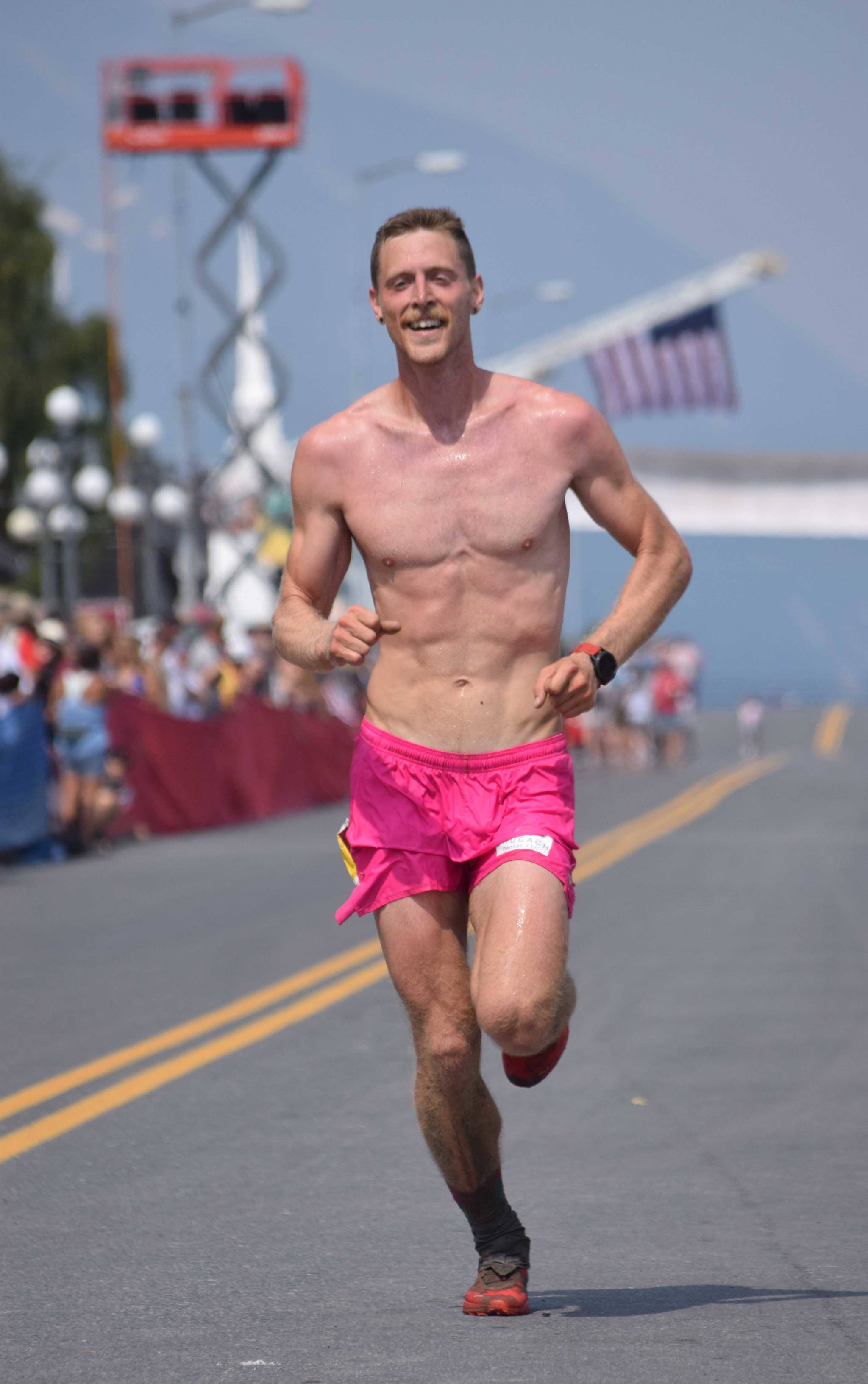 Anchorage’s Lars Arneson, a 2009 graduate of Cook Inlet Academy, finishes third in the men’s Mount Marathon Race on Thursday, July 4, 2019, in Seward, Alaska. (Photo by Jeff Helminiak/Peninsula Clarion)