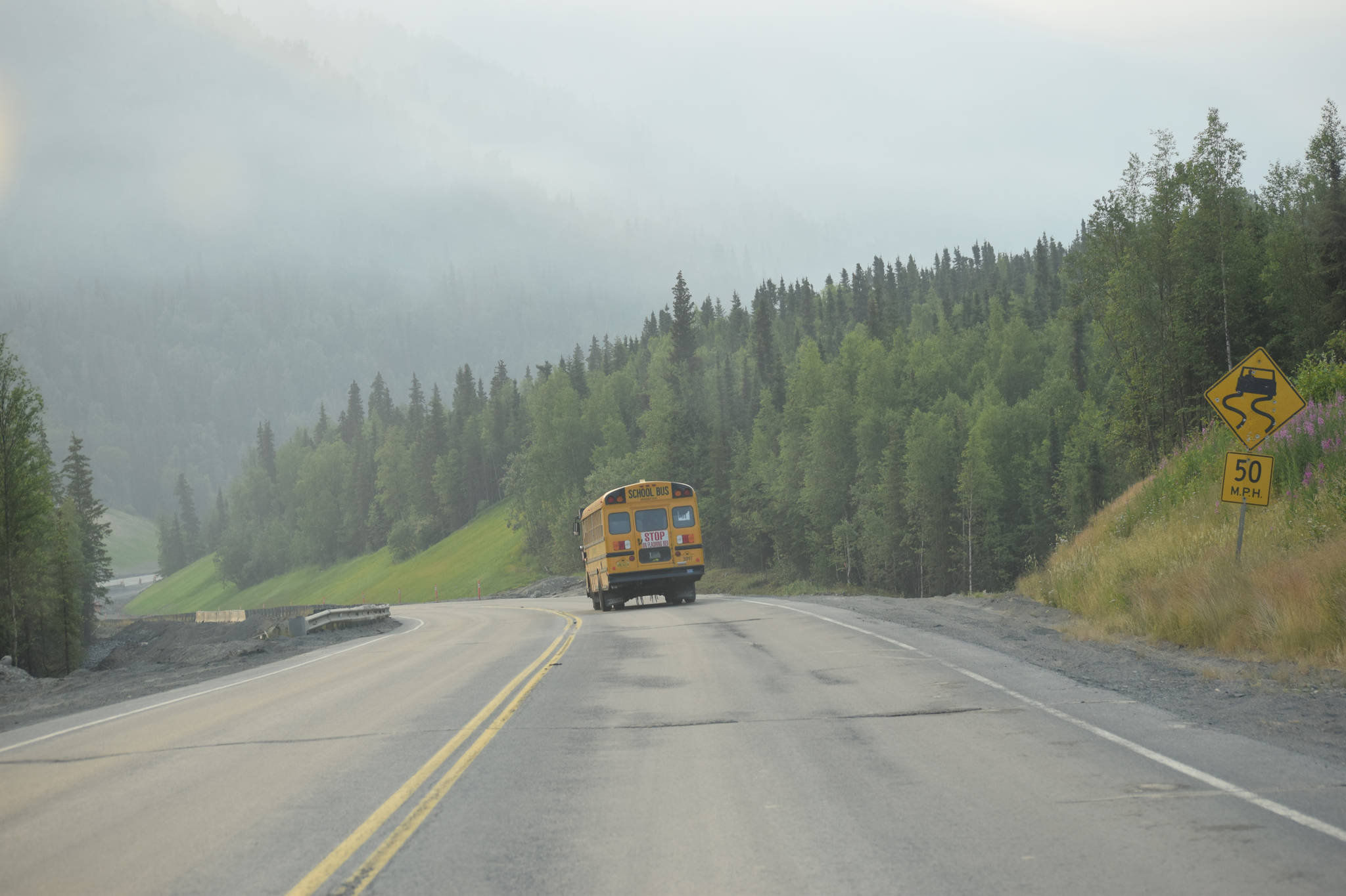 Smoke from the Swan Lake Fire can be seen on the Sterling Highway near the Mystery Hills Thursday, July 4, 2019, on the Kenai Peninsula, Alaska. (Photo by Jeff Helminiak/Peninsula Clarion)