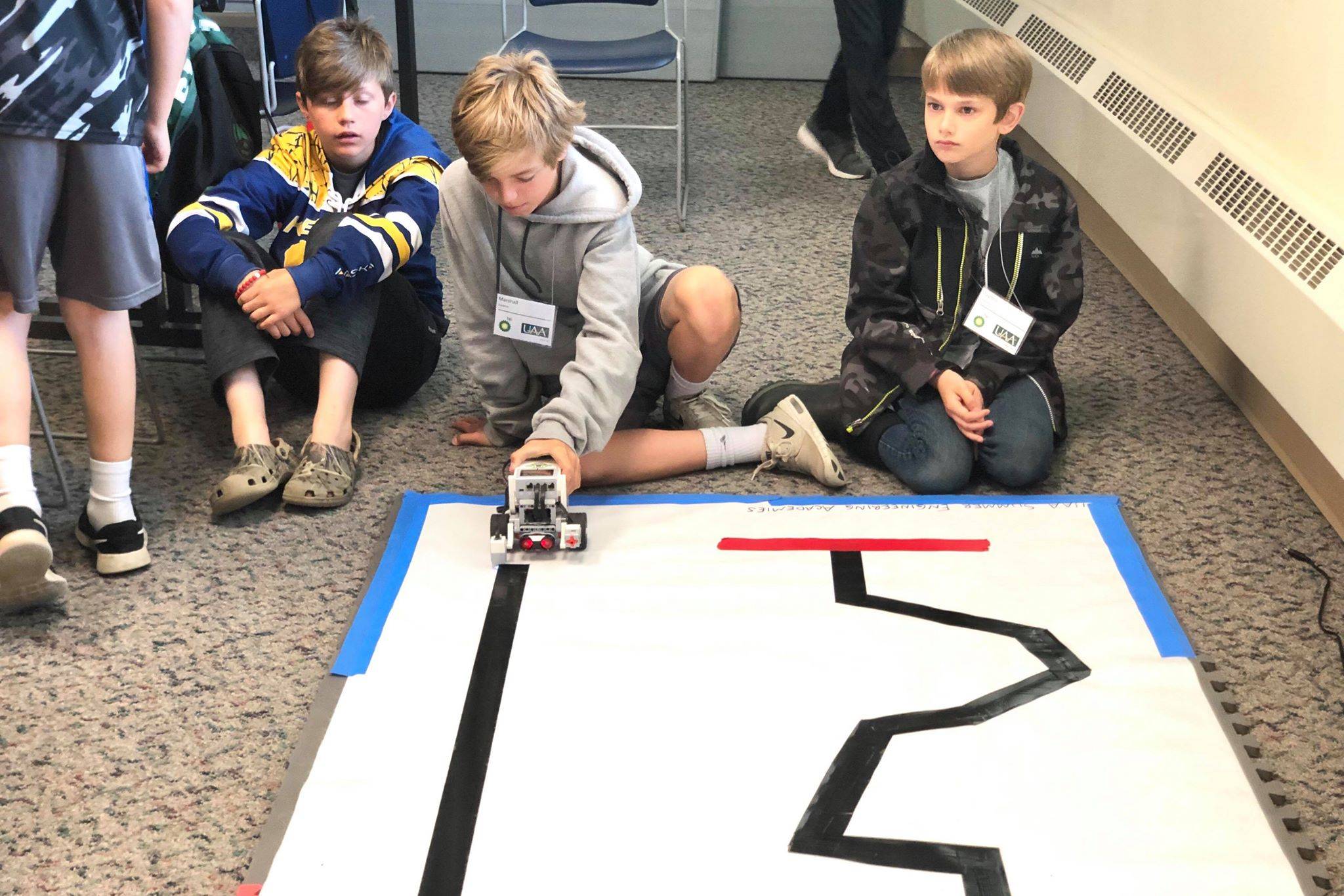 Students put their robot to the test in one of the many challenges in the Lego robotics UAA College of Engineering Summer Engineering Academies, on Wednesday, June 26, 2019, at the Kenai Peninsula College near Soldotna, Alaska. (Photo by Victoria Petersen/Peninsula Clarion)