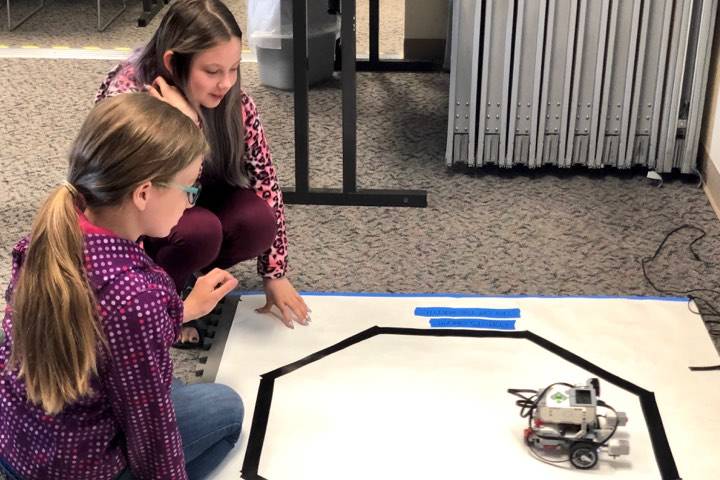 Students, Claira and Aliya, put their robot to the test in one of the many challenges in the Lego robotics UAA College of Engineering Summer Engineering Academies, on Wednesday, June 26, 2019, at the Kenai Peninsula College near Soldotna, Alaska. (Photo by Victoria Petersen/Peninsula Clarion)