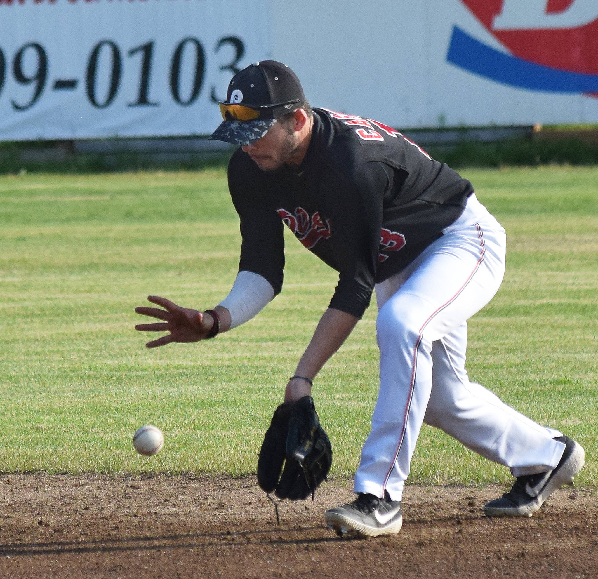 Peninsula Oilers second baseman Victor Carlino scoops up a ground ball from a Mat-Su Miners batter Friday, July 5, 2019, at Coral Seymour Memorial Park in Kenai, Alaska. (Photo by Joey Klecka/Peninsula Clarion)