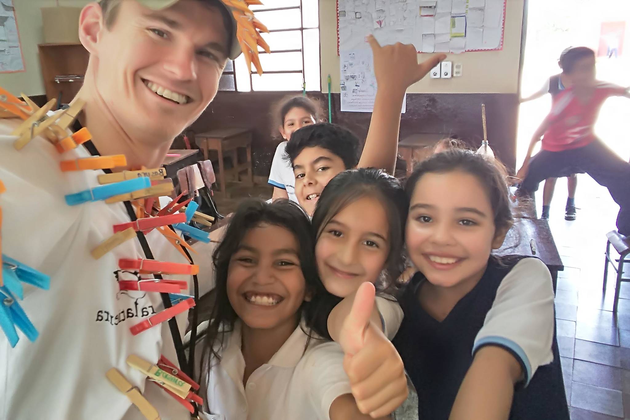 Brandon Gustafson takes a selfie with third graders from the elementary school in San Cosme Y Damián, Itapuá District, Paraguay after teaching them about water contamination in this undated photo. (Courtesy Brandon Gustafson)