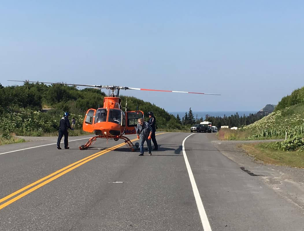 Crews in a LifeMed helicopter prepare to transport a victim of a two-vehicle fatal car crash on July 7, 2019, near Mile 142 Sterling Highway, Happy Valley, Alaska. The driver of one car involved in the crash, Michael Franklin, 18, of Homer, Alaska, died of his injuries at the scene. (Photo by Jon Marsh/Anchor Point Fire and EMS)