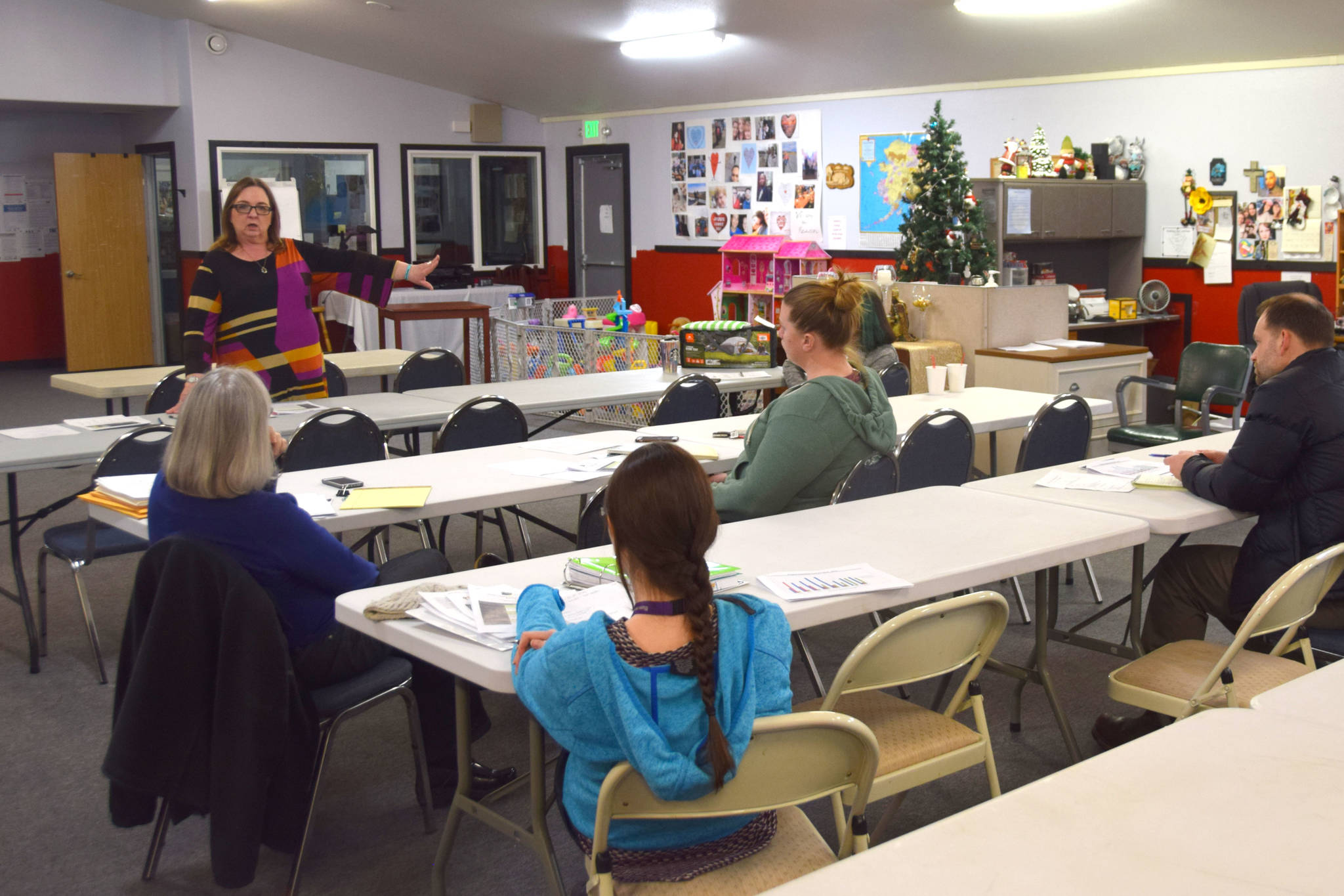 Members of a workgroup to acquire a permanent emergency shelter on the Kenai Peninsula meet at Love, INC in Soldotna, Alaska on Feb. 11, 2019. (Photo by Brian Mazurek/Peninsula Clarion)