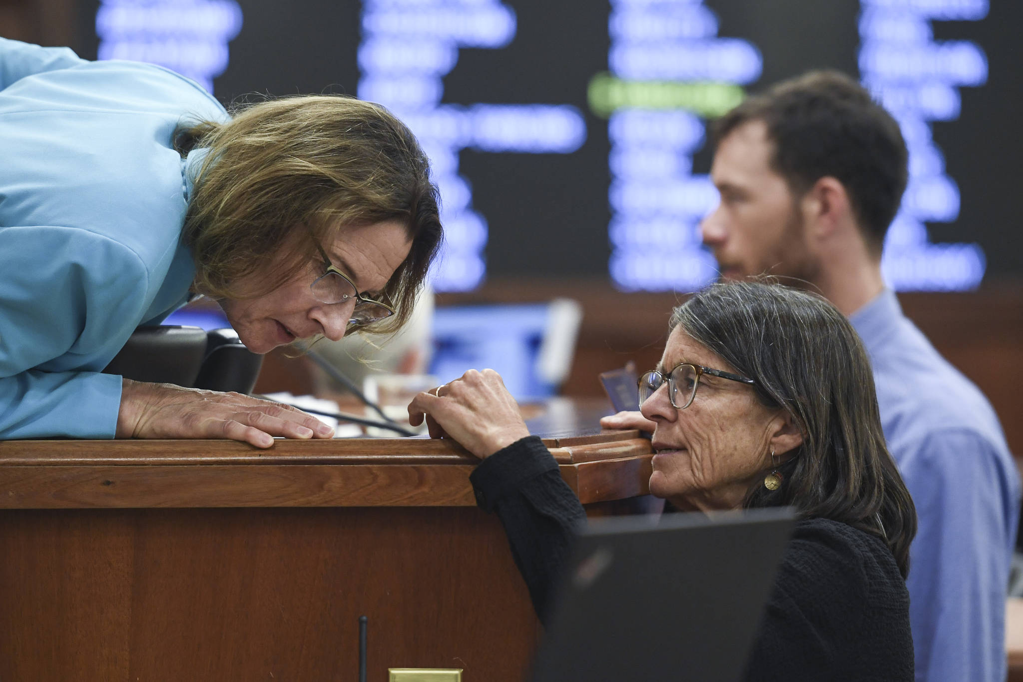 Michael Penn / Juneau Empire                                 Senate President Cathy Giessel, R-Anchorage, (left) leans in to listen to Rep. Jennifer Johnston, R-Anchorage, during a Joint Session of Alaska Legislature at the Capitol on Thursday to debate and vote on an override of Gov. Mike Dunleavy’s budget vetoes. The vote didn’t take place.