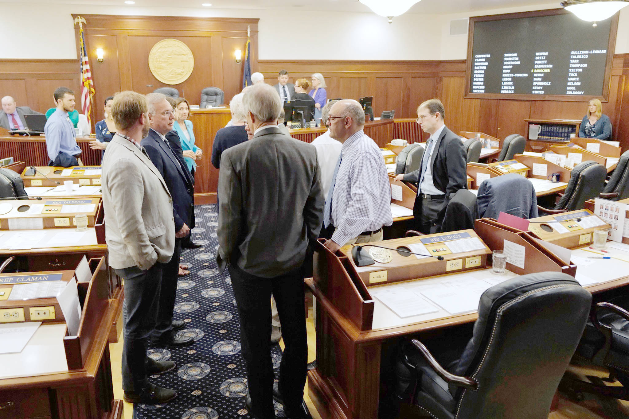 Michael Penn/The Juneau Empire                                Lawmakers talk among themselves during a break of a joint session of the Alaska Legislature on Thursday in Juneau.