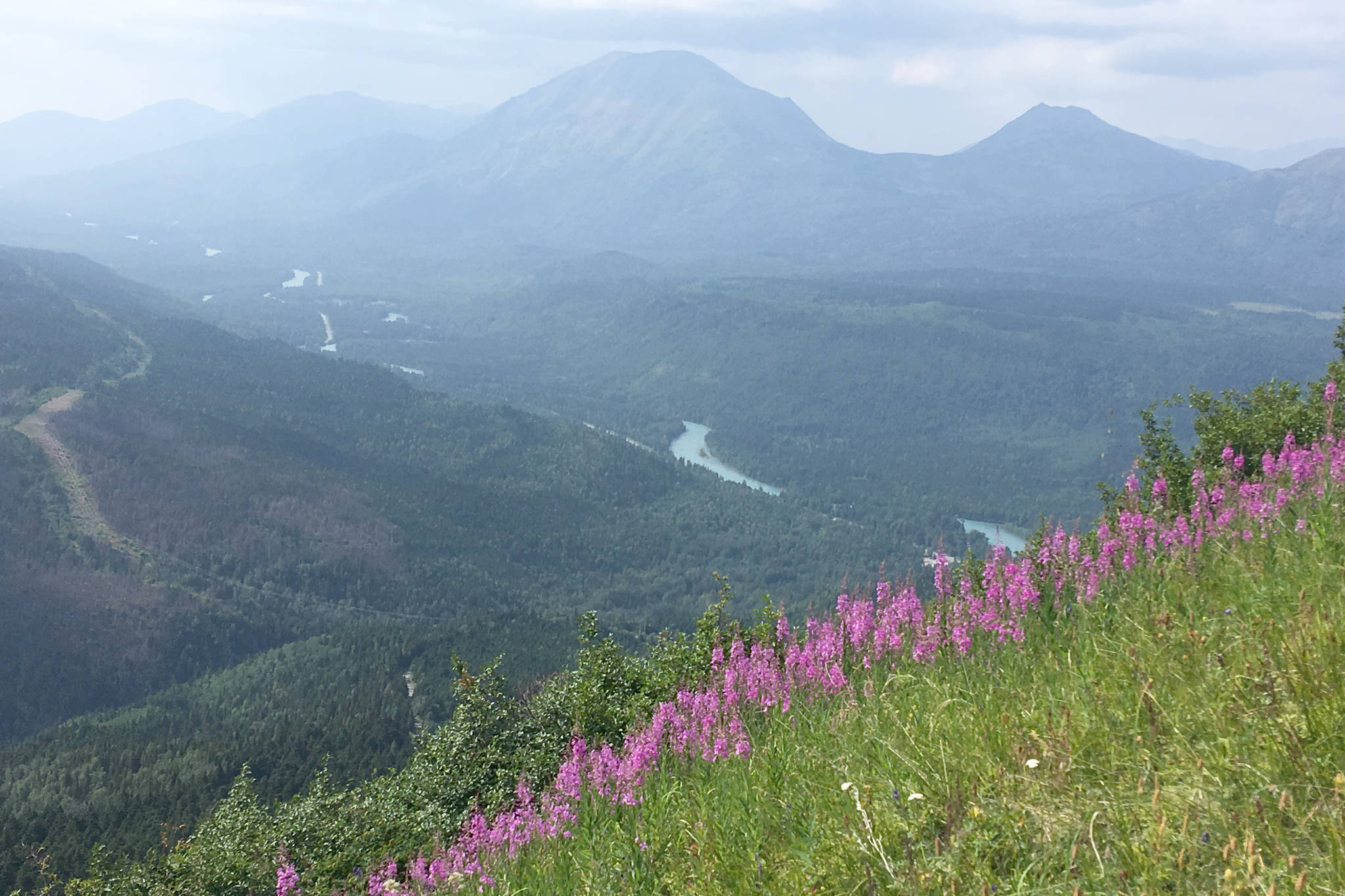 Smoke from the Swan Lake Fire can be seen over the Kenai River valley from Cecil Rhode mountain in Cooper Landing, Alaska, on Friday, July 12, 2019. (Photo by Jeff Helminiak)