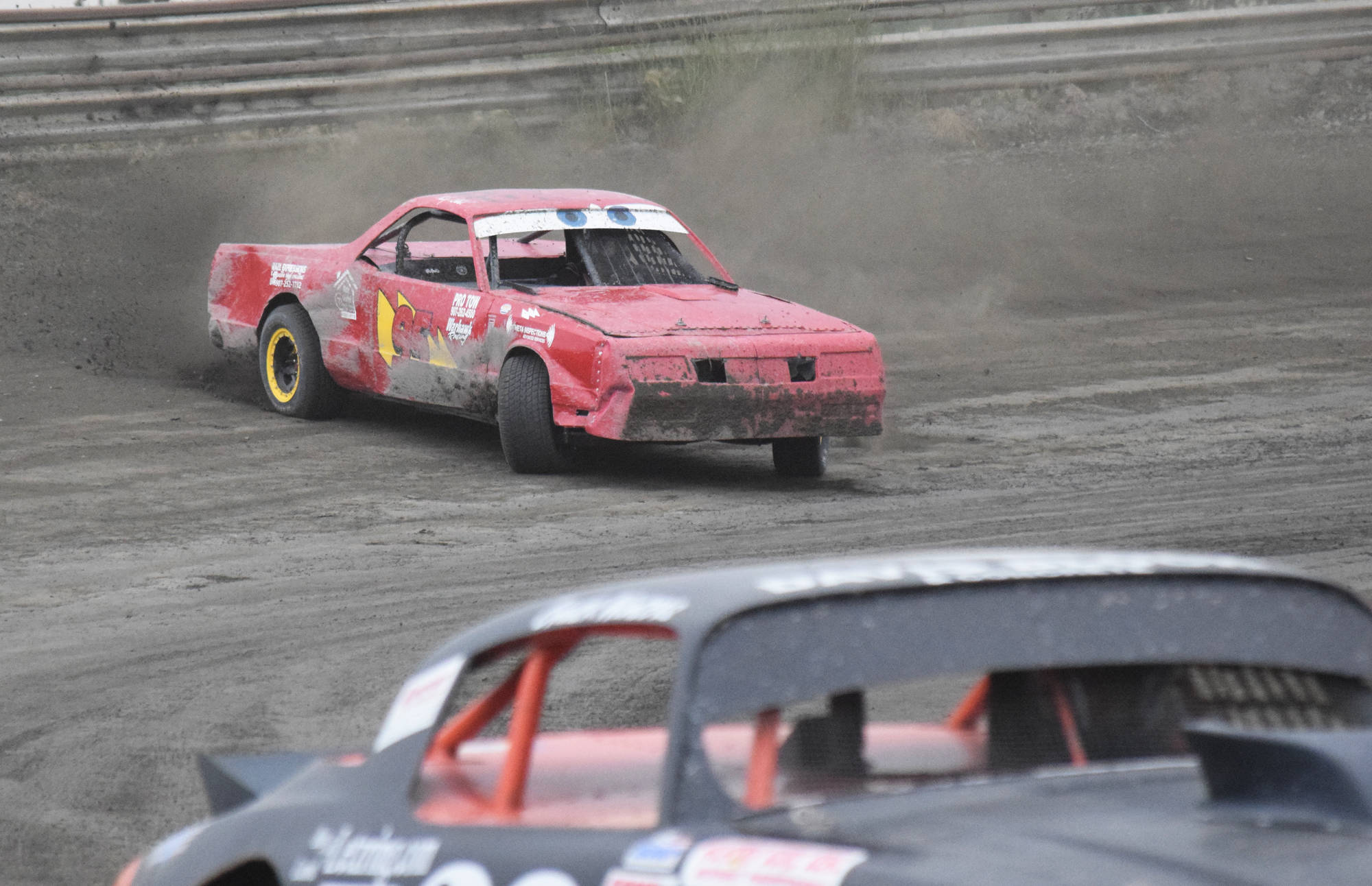 Mady Stichal slides her No. 95 A-Stock car around the turn Saturday, July 13, 2019, during the Powder Puff feature race at Twin City Raceway in Kenai, Alaska. (Photo by Joey Klecka/Peninsula Clarion)