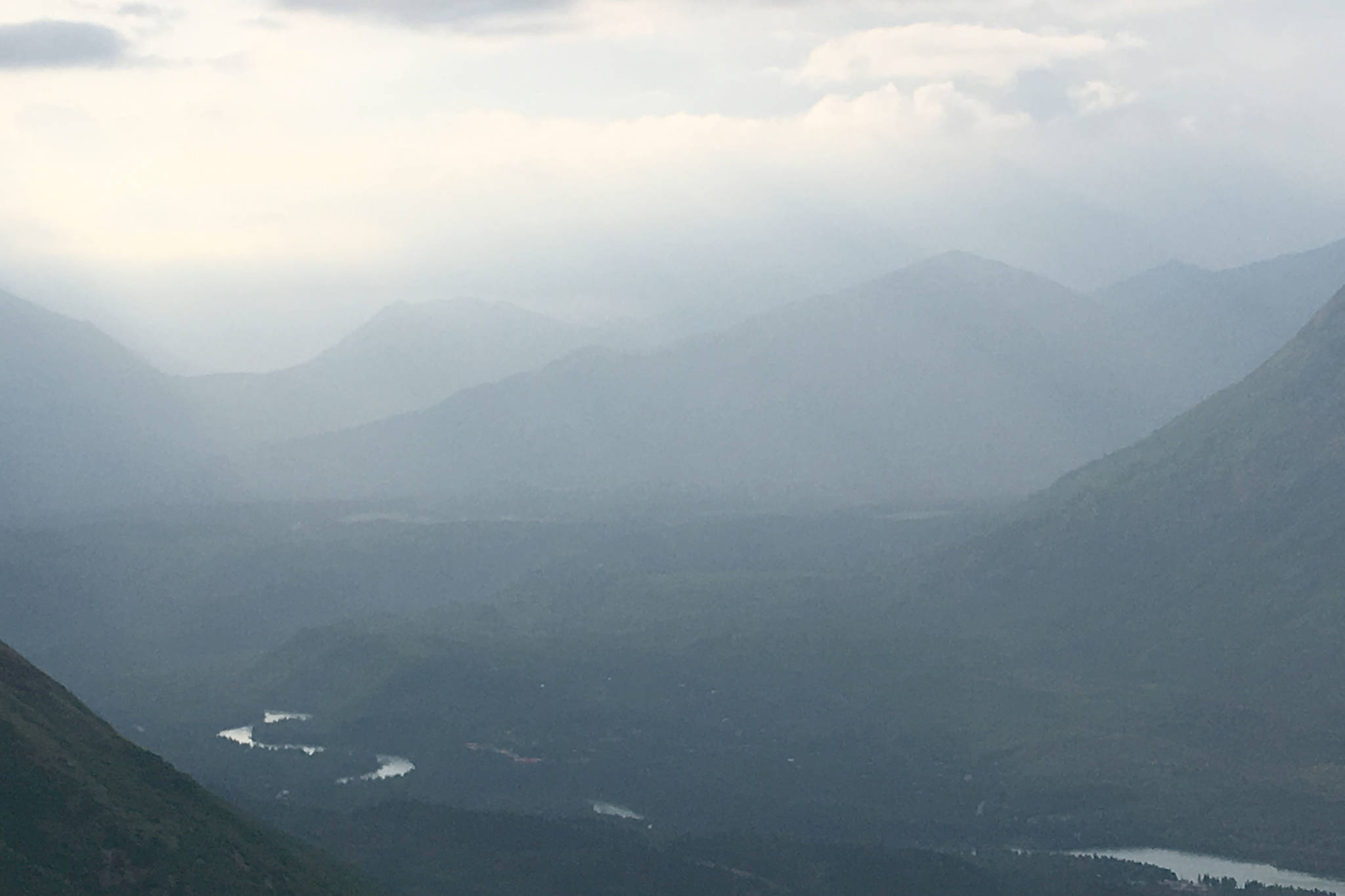 Smoke from the Swan Lake Fire can be seen over the Kenai River valley from Cecil Rhode mountain in Cooper Landing, Alaska, on Friday, July 12, 2019. (Photo by Jeff Helminiak)