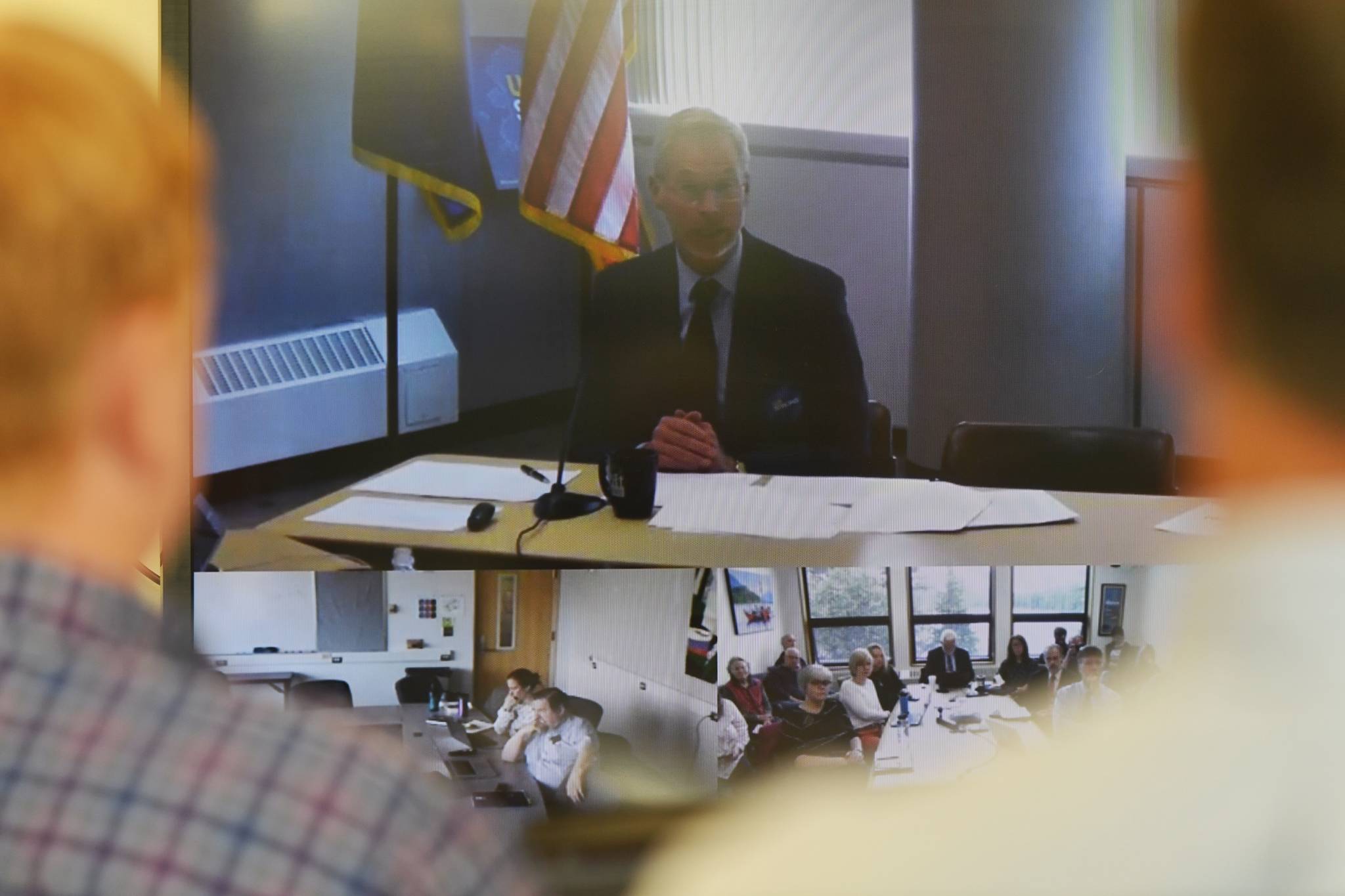 University of Alaska Southeast administrators and staff watch University President Jim Johnsen during an online meeting being held at UA campuses around the state on Gov. Mike Dunleavy’s budget cuts on Monday, July 15, 2019. (Michael Penn | Juneau Empire)