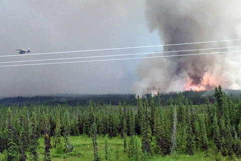 The Swan Lake Fire can be seen from the East Fork Moose River bridge on Thursday, June 27, 2019. (Photo courtesy Robert Kuiper)