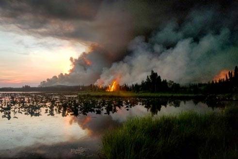A view of the back burning operations being conducted on the Swan Lake Fire as seen from Watson Lake in June 2019. (Courtesy Jessica St. Laurent/BLM Alaska Fire Medic)