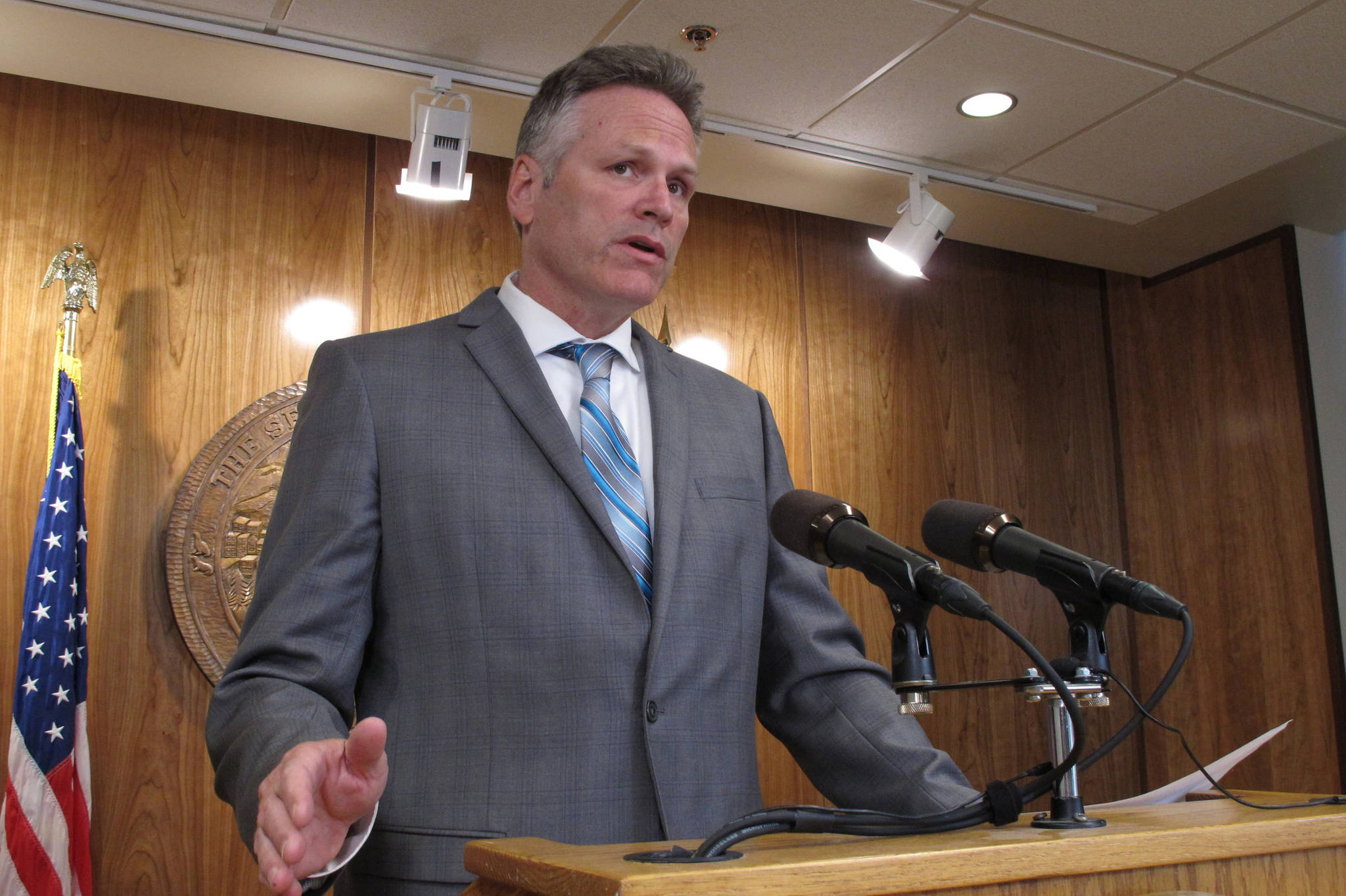 Gov. Mike Dunleavy speaks to reporters about his budget vetoes at the state Capitol in Juneau, June 28. (AP Photo/Becky Bohrer)