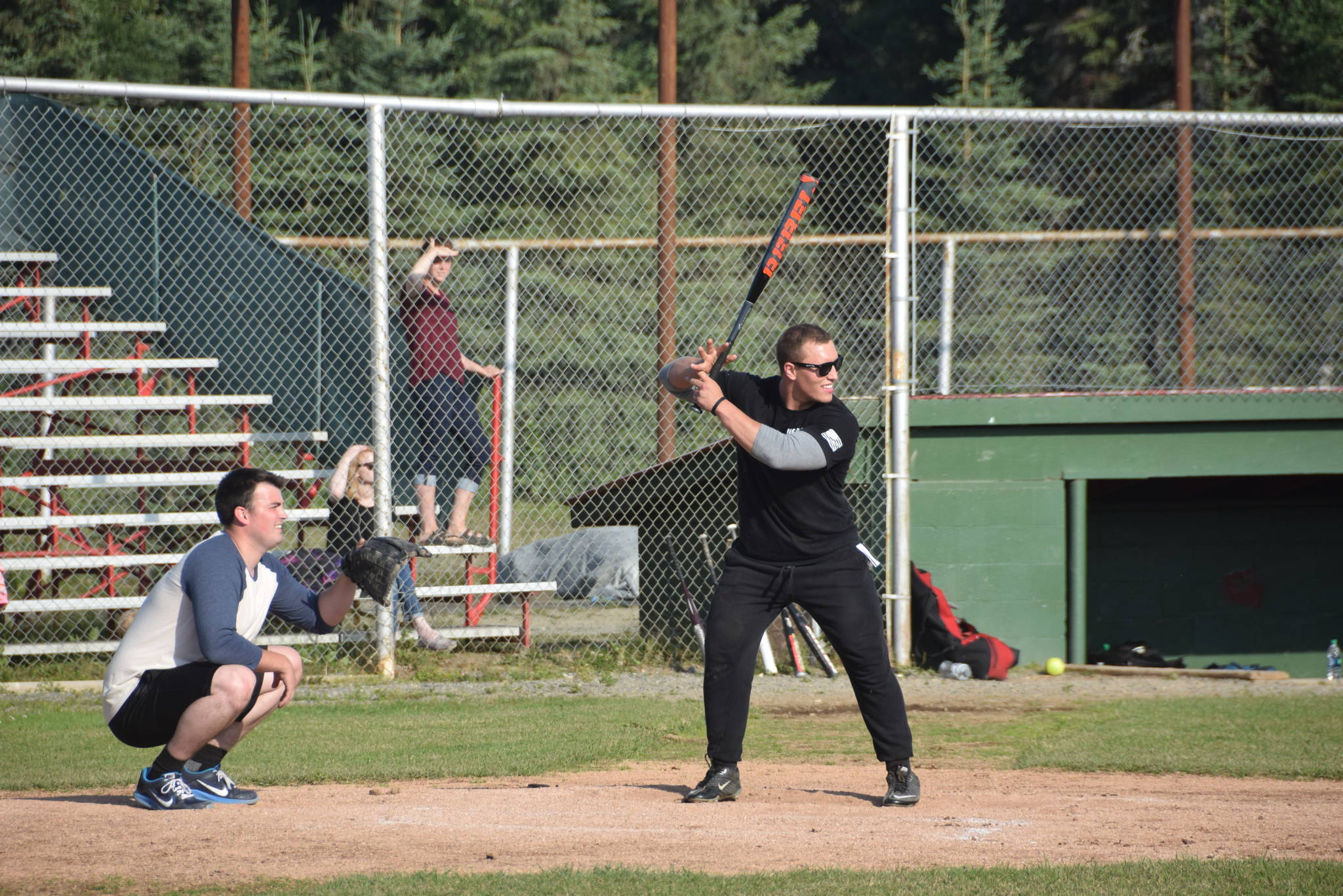 Brian Mazurek / Peninsula Clarion                                Nikiski firefighter Stephen Hartley steps up to the plate during the third annual Guns and Hoses charity baseball game Friday at Coral Seymour Memorial Park in Kenai. Local law enforcement and firefighters went head-to-head Friday night to raise money for the Nikiski Children’s Fund. The firefighters from Nikiski and Kenai put up a valiant effort, but the boys in blue ultimately won the game 6-5. Bailey Epperheimer, executive director for the Nikiski Children’s Fund, said that they were able to raise over $1,800 on Friday night, the most amount of money raised by the nonprofit from a single event.