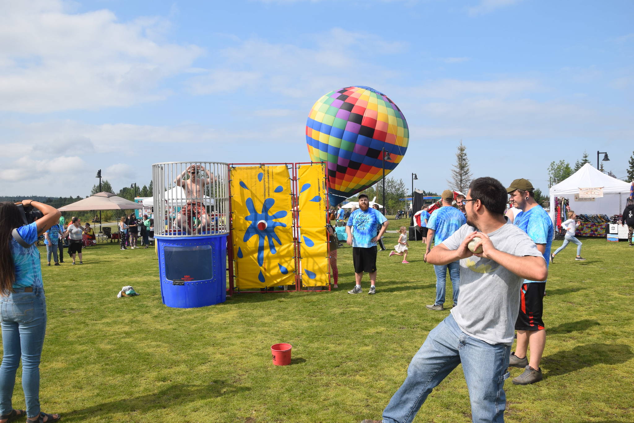 Brian Mazurek / Peninsula Clarion                                A participant in the 2019 Disability Pride Celebration in Soldotna Creek Park tries his hand at the dunk tank Saturday.