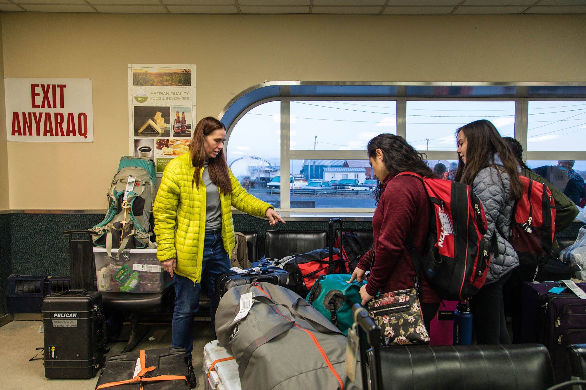 Ellen Piekarski, then a math teacher at East Anchorage High School, works with her students to organize their luggage on their trip to Scammon Bay. (Photo by Erin Irwin/Education Week)