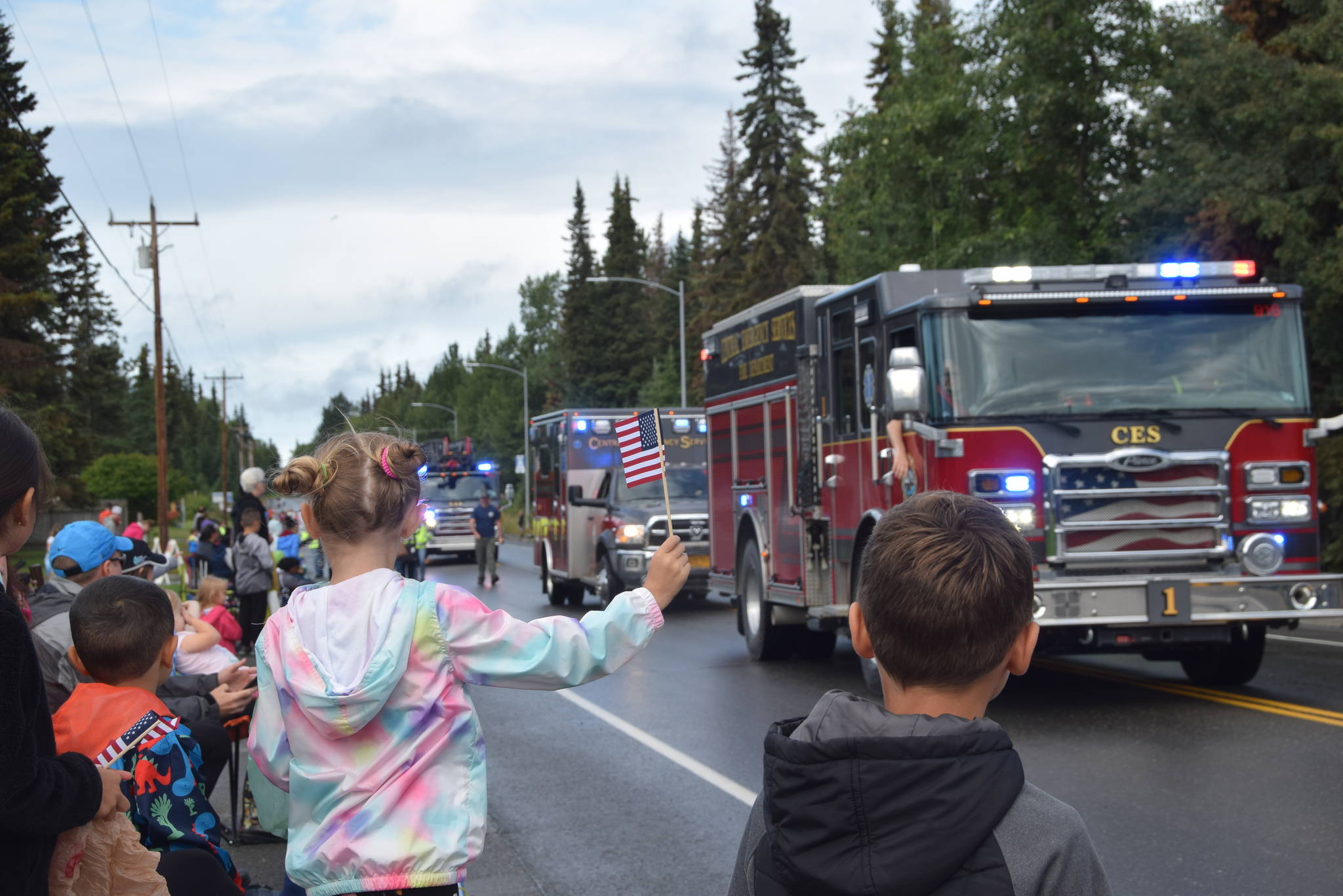 Onlookers watch the parade go by during Soldotna’s Progress Day Parade in Soldotna, Alaska on July 27, 2019. (Photo by Brian Mazurek/Peninsula Clarion)