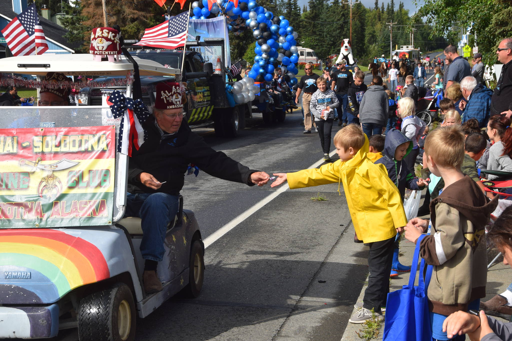 Photo by Brian Mazurek/Peninsula Clarion                                 A volunteer from the Soldotna Shriners hands out candy during Soldotna’s Progress Day Parade in Soldotna, Saturday.