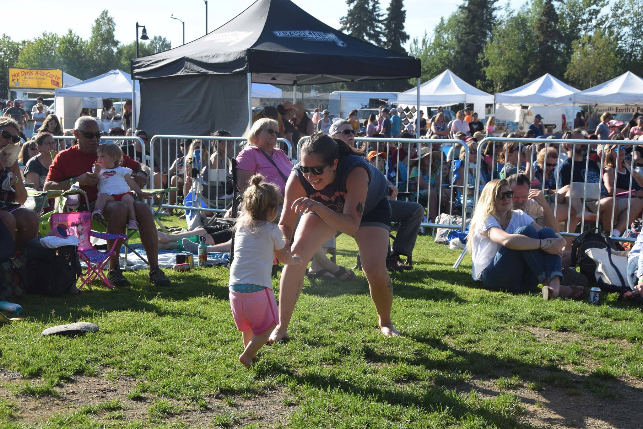 Visitors to the Levitt AMP Soldotna Music Series dance to the music at Soldotna Creek Park on July 3, 2019. (Photo by Brian Mazurek/Peninsula Clarion)