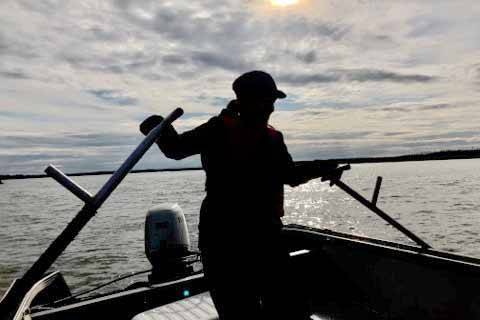 Photo courtesy of Robert Valadez                                A dipnetter fishes on a boat in the Kenai River in July.
