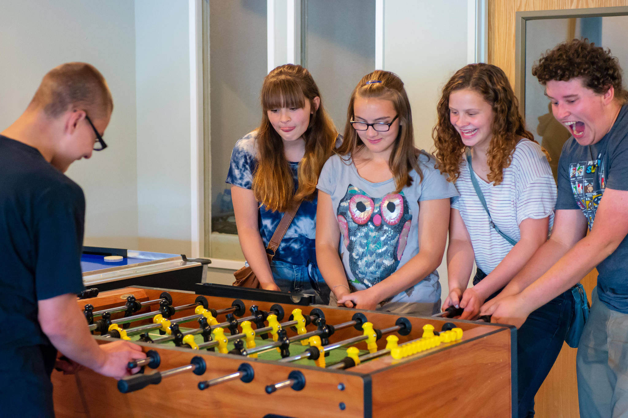 From left, James Lathem, Lacey Lamb, Jenna Carpenter, Lilly Lamb and Hugh Nelson play a round of foosball at the Compass Youth Center in Nikiski, Alaska on Sept. 5, 2018. (Photo courtesy Dan Smouse)