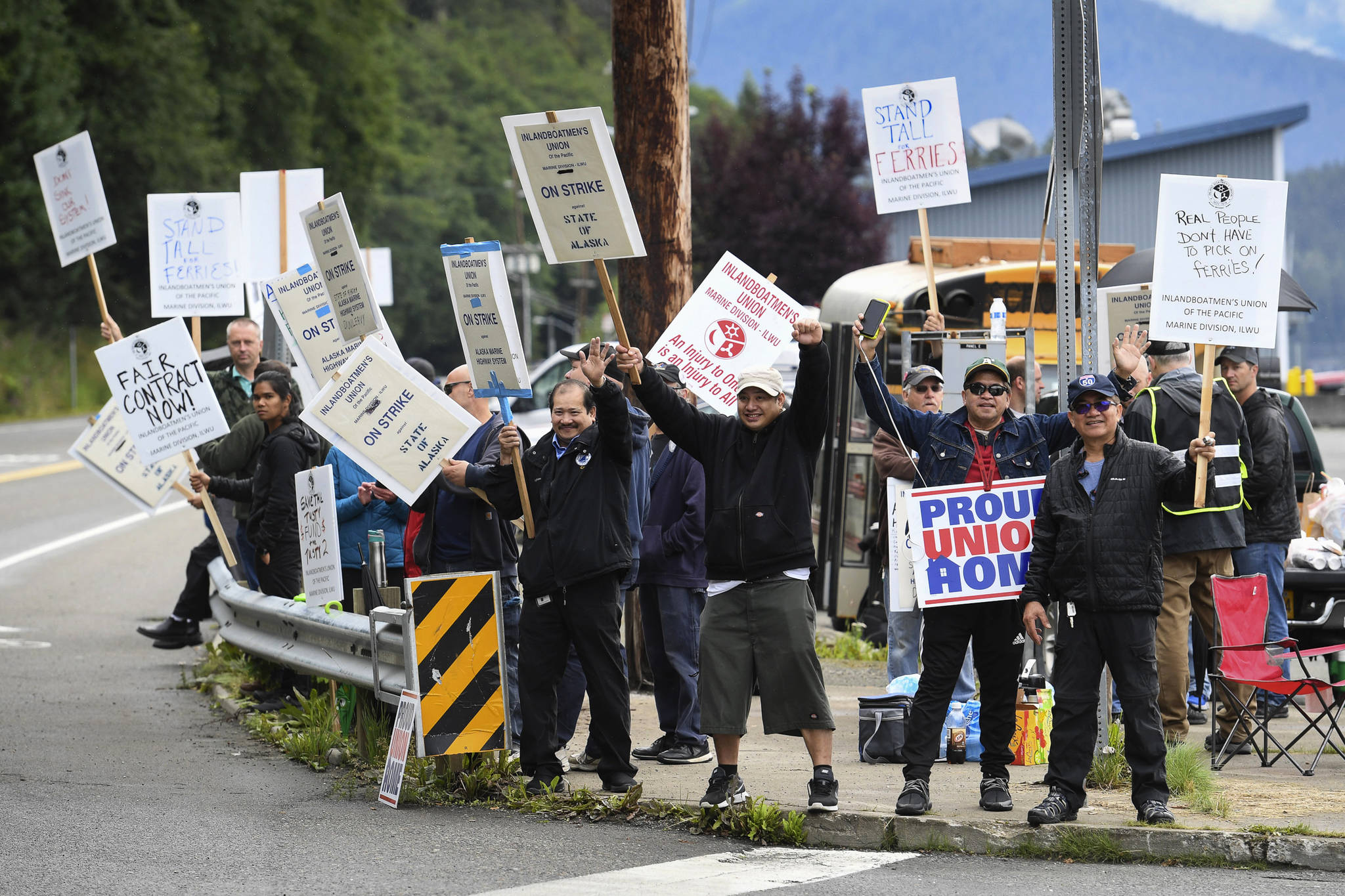 Members of the Inland Boatmen’s Union of the Pacific picket in front of the Auke Bay Terminal in Juneau, Alaska, Thursday, July 25, 2019. The union called a strike on Wednesday over failed negotiations with Gov. Mike Dunleavy’s administration. State officials said Thursday more than $580,000 in fares has been refunded to passengers affected by striking ferry workers. (Michael Penn/The Juneau Empire via AP)