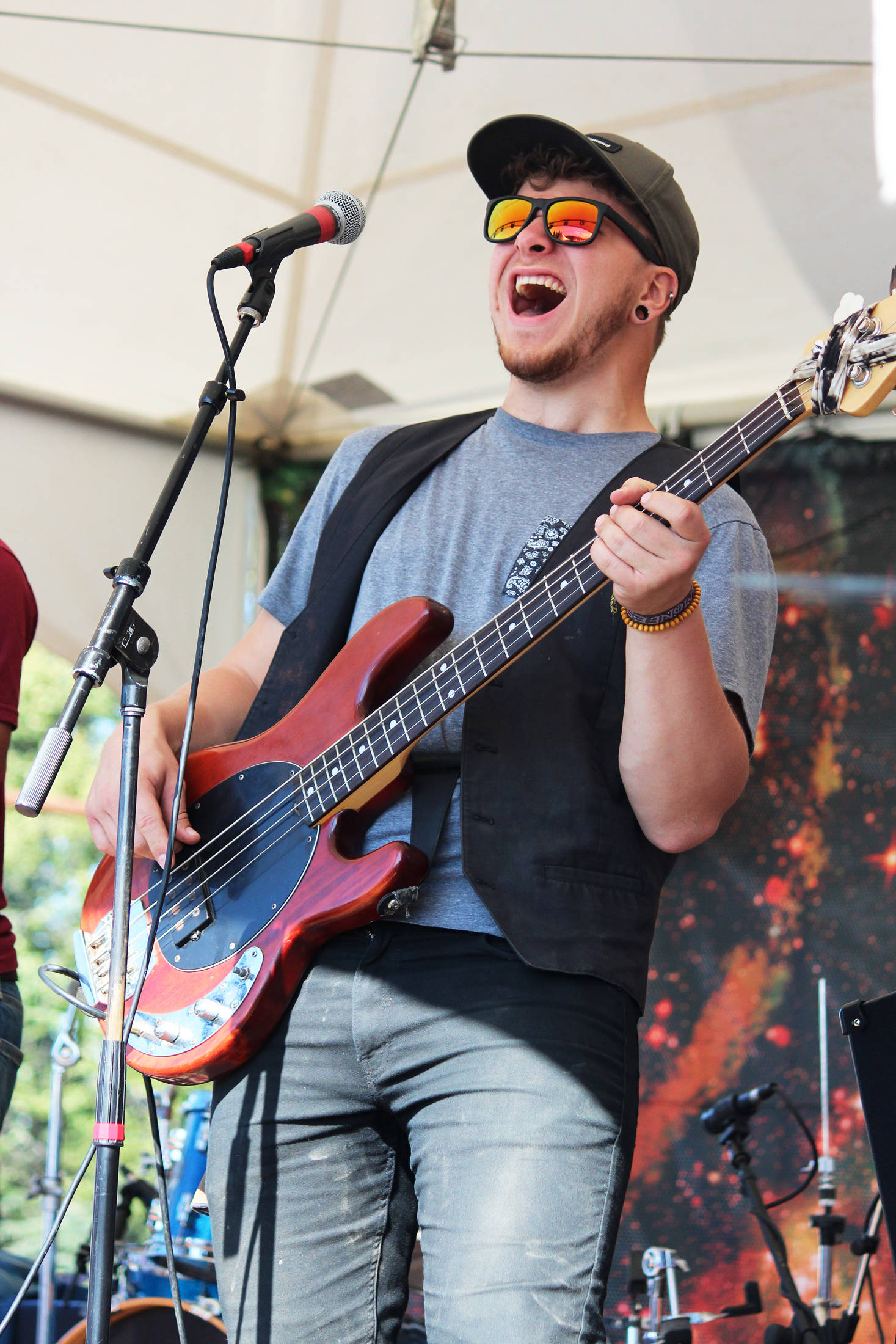 Ben Sayers, bass player for Blackwater Railroad Company, performs with the band on the River Stage on Friday, Aug. 2, 2019 at Salmonfest in Ninilchik, Alaska. (Photo by Megan Pacer/Homer News)                                Ben Sayers, bass player for Blackwater Railroad Company, performs with the band on the River Stage on Friday, Aug. 2, 2019 at Salmonfest in Ninilchik, Alaska. (Photo by Megan Pacer/Homer News)