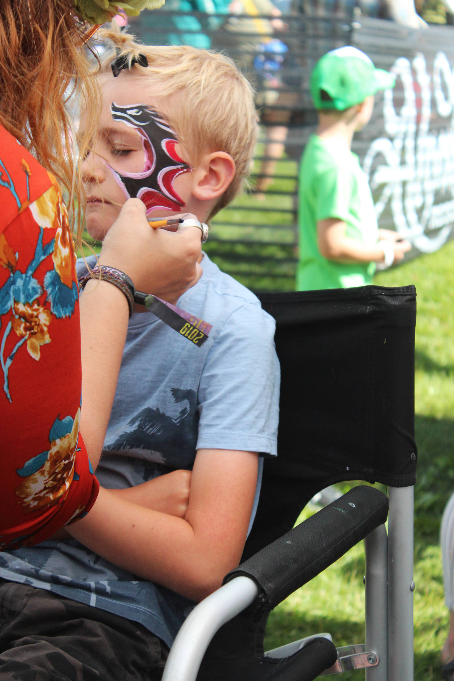 Photo by Megan Pacer / Homer News                                Iver Ledahl, 8, of Kenai, gets his face painted Friday at Salmonfest.