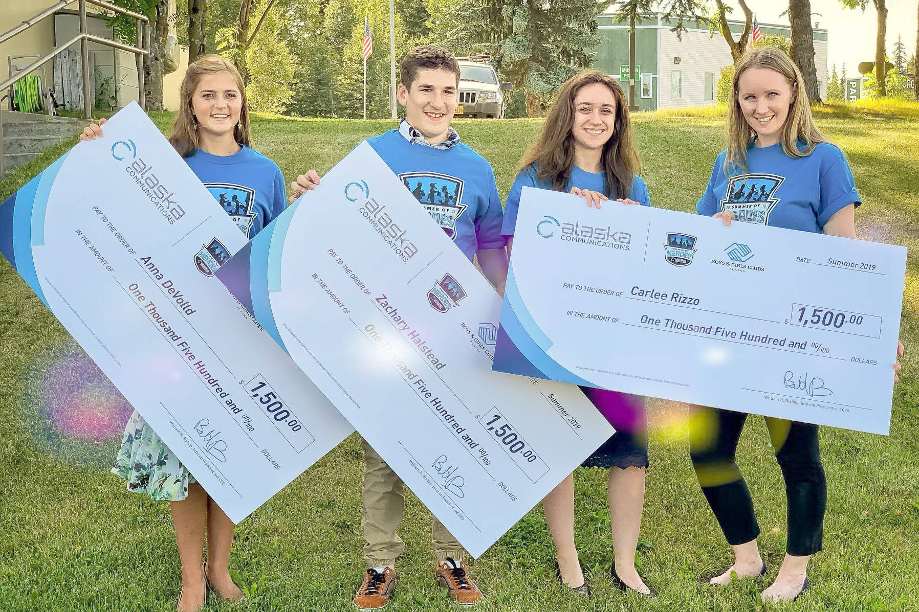 Heather Marron of Alaska Communications presents the $1,500 awards to three peninsula teens (from right) — Anna DeVolld, Zachary Halstead and Carlee Rizzo — who were honored in the Summer of Heroes program, on Monday, Aug. 5, 2019, in Soldotna, Alaska. (Photo courtesy of Pegge Erkeneff/Kenai Peninsula Borough School District)