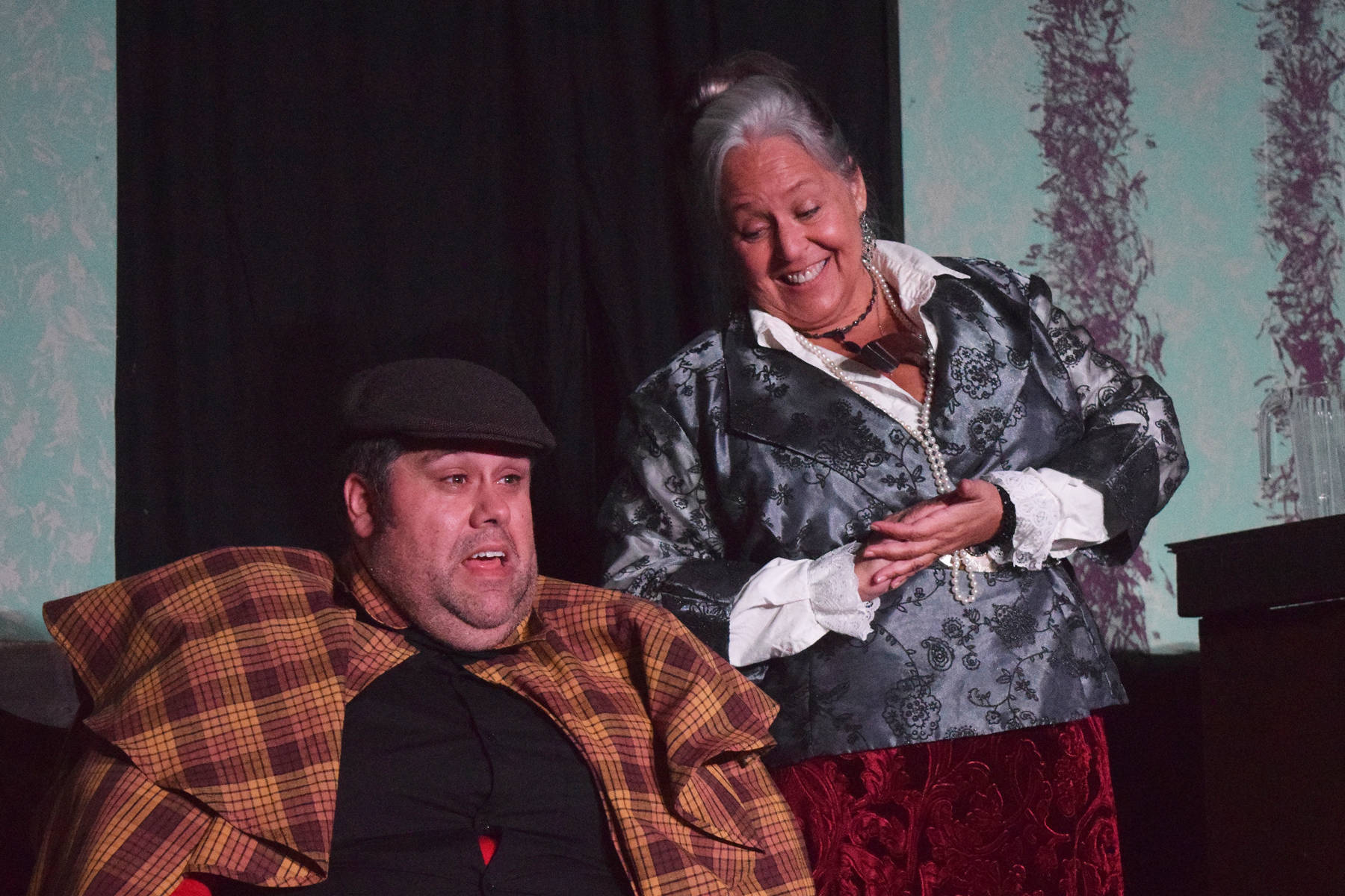 Ian McEwan (left) acts out a scene with Yvette Tappana during a rehearsel for Blazing Guns at Roaring Gulch held Thursday, Aug. 8, 2019, at the Kenai Performer’s stage in Soldotna. (Photo by Joey Klecka/Peninsula Clarion)