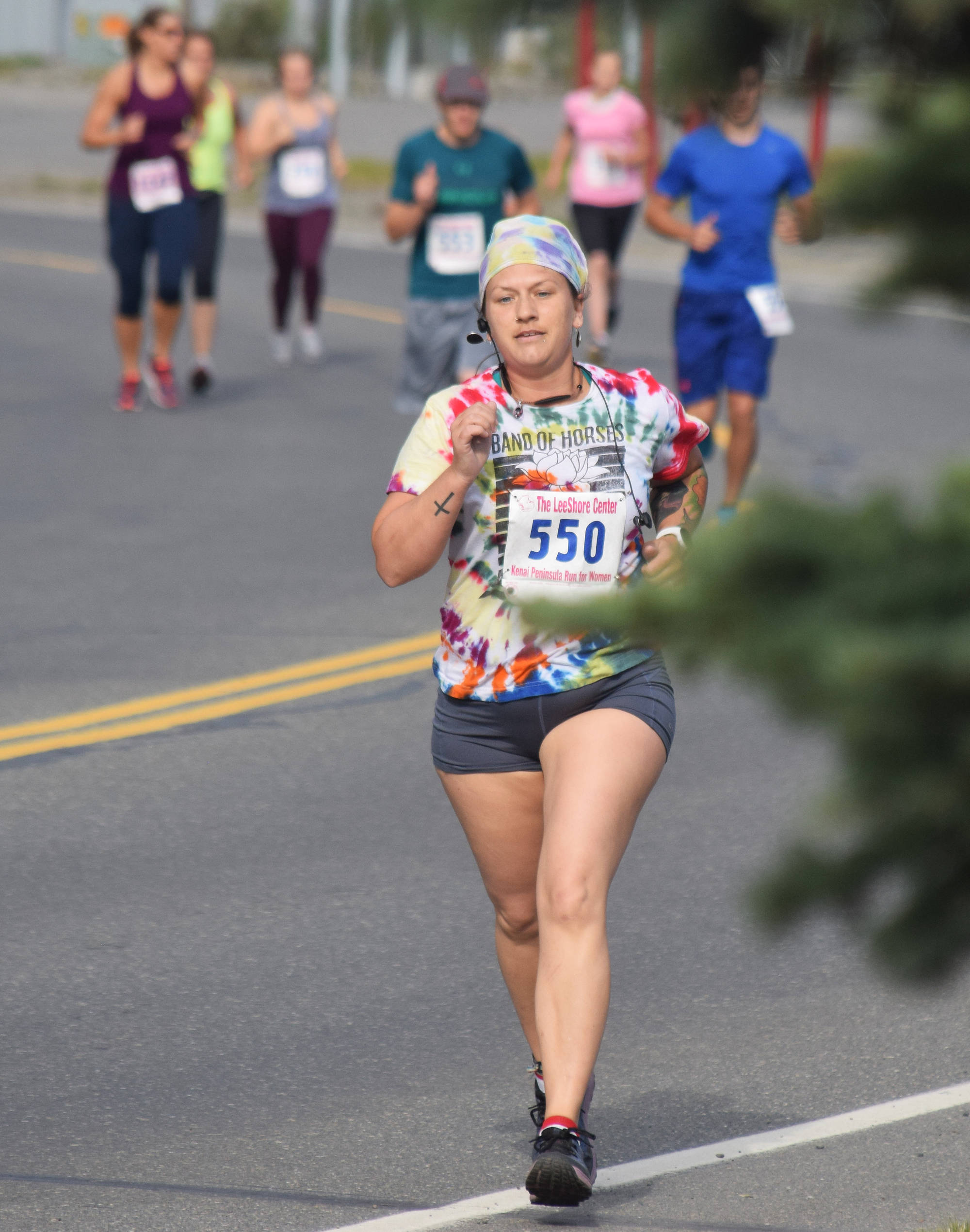 Tara Wade leads the 5K and 10K fields out Saturday, Aug. 10, 2019, at the 32nd annual Run for Women in Kenai, Alaska. (Photo by Joey Klecka/Peninsula Clarion)