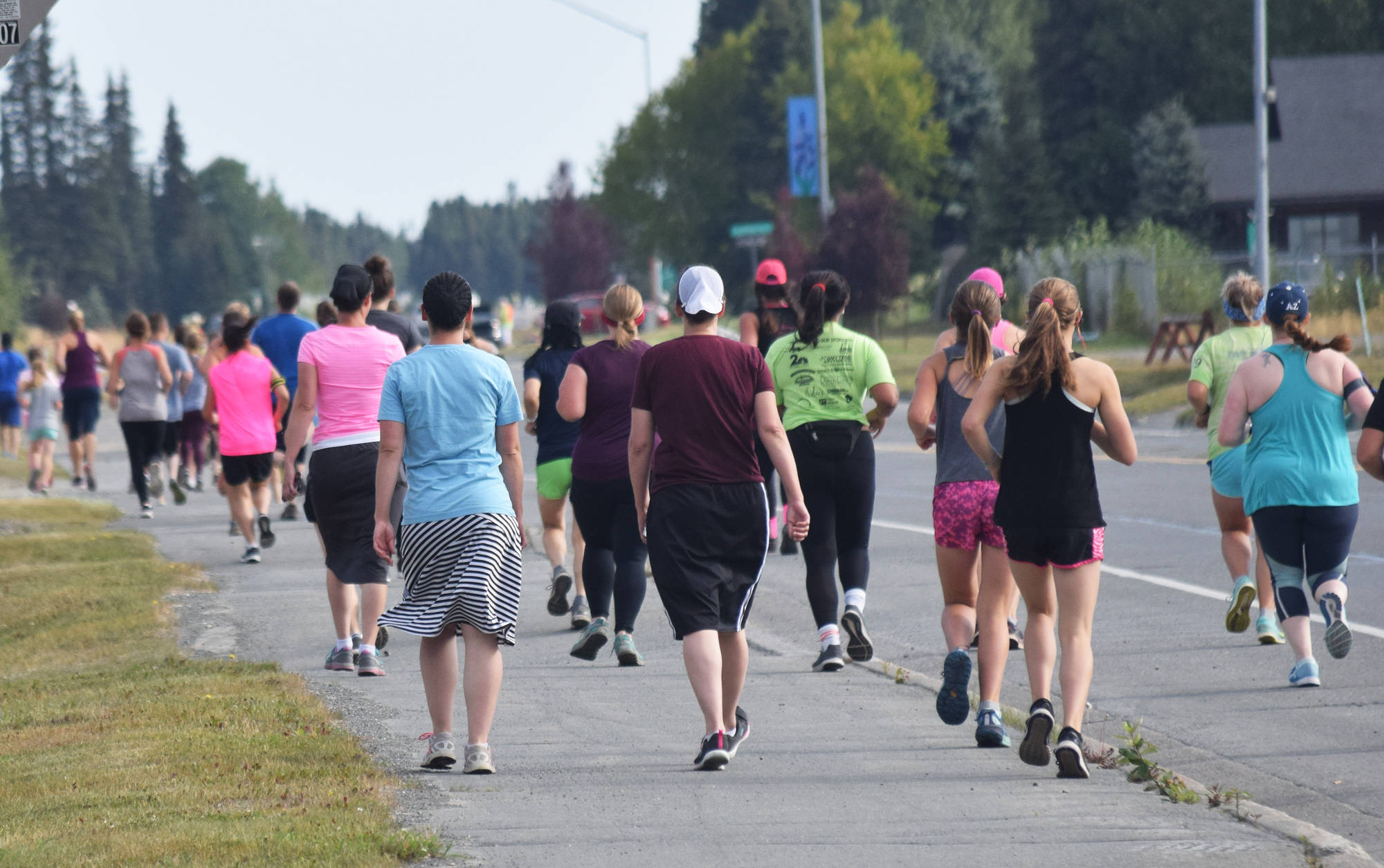 The field of 5K and 10K runners and walkers take to the streets Saturday, Aug. 10, 2019, at the 32nd annual Run for Women in Kenai, Alaska. (Photo by Joey Klecka/Peninsula Clarion)