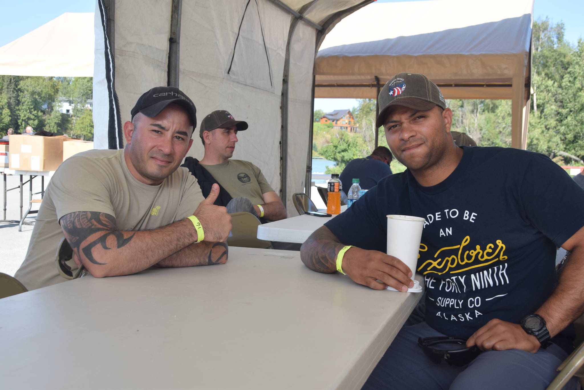 Staff Sgt. Richard Ellis and Staff Sgt. Louigy Buduan smile for the camera during the Wounded Warrior’s Fishing Trip in Centennial Park in Soldotna, Alaska on Aug. 9, 2019. (Photo by Brian Mazurek)