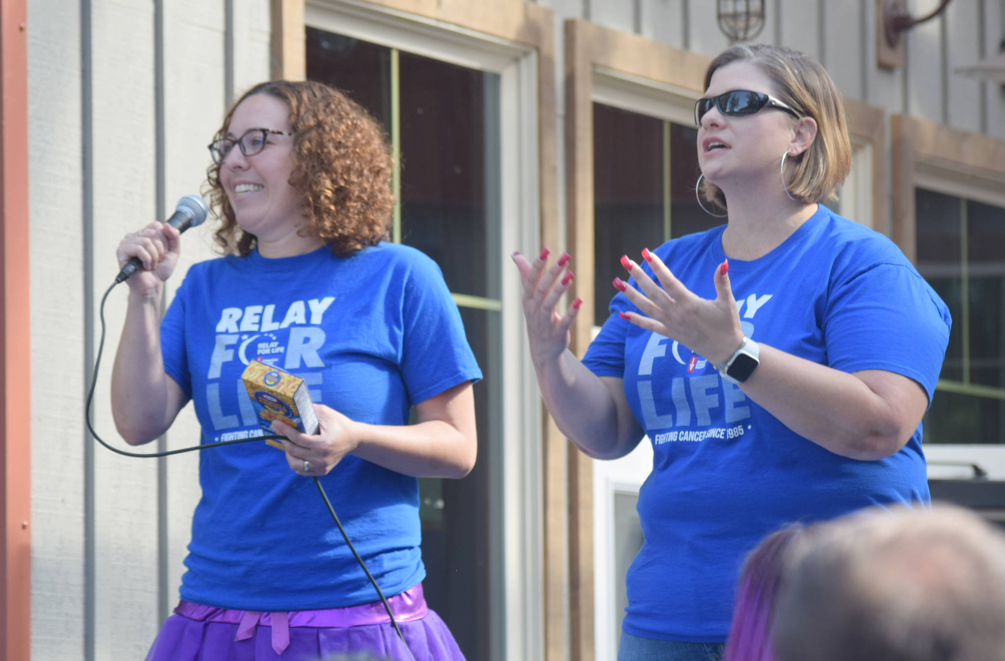 Alana Martin and Johna Beech of Kenai Penisula Relay For Life address runners before the start of the Brewery to Bathroom .5K “The race for the rest of us” on Sunday, Aug. 11, 2019, in Soldotna, Alaska. (Photo by Jeff Helminiak/Peninsula Clarion)