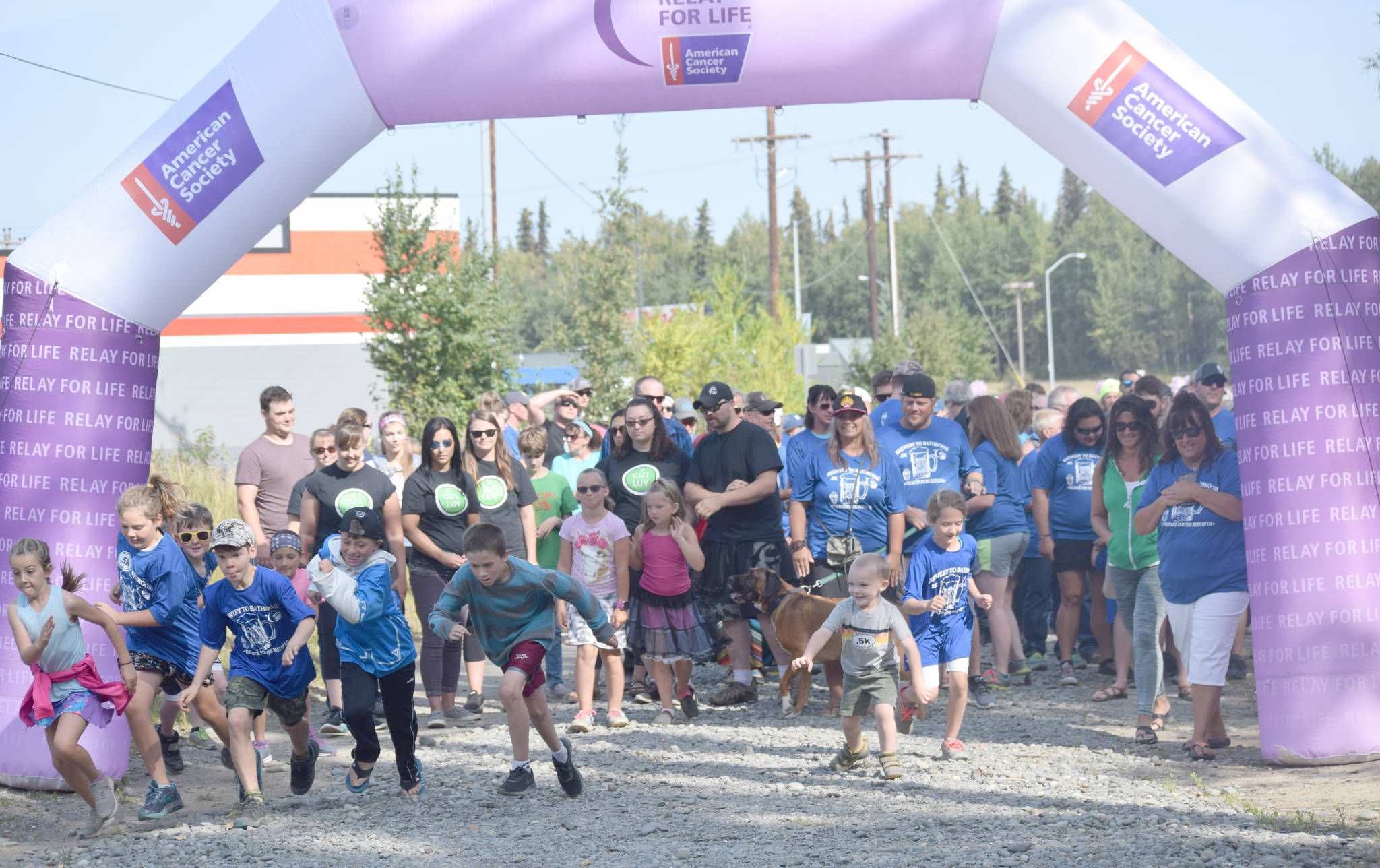 Jeff Helminiak / Peninsula Clarion                                Kids burst from the start of the Brewery to Bathroom .5K “The race for the rest of us” in Soldotna on Sunday.