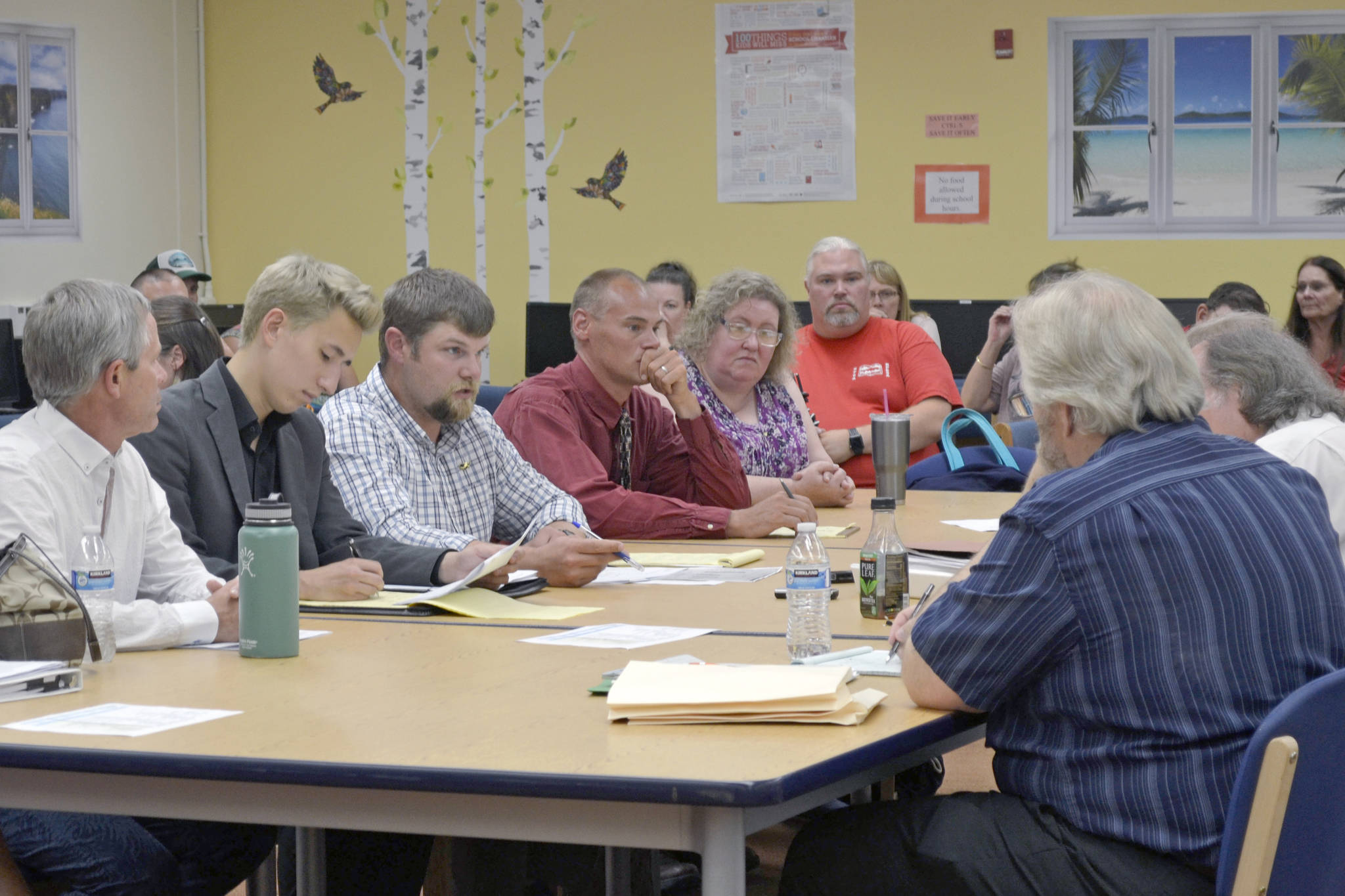 The Kenai Peninsula Borough School District and two employee associations — The Kenai Peninsula Borough Education Association and the Kenai Peninsula Borough Education Support Association — negotiate for a new contract on Tuesday, Aug. 13, 2019, at the Soldotna High School Library, in Soldotna, Alaska. (Photo by Victoria Petersen/Peninsula Clarion)