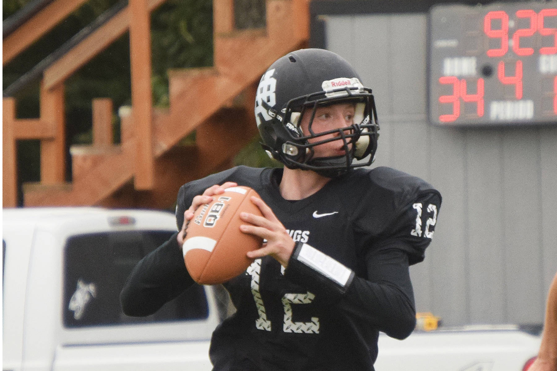 Nikiski junior Noah Litke scans the field for an open receiver Aug. 18, 2018, against Valdez at Nikiski High School. Litke returns this year to quarterback the Bulldogs. (Photo by Joey Klecka/Peninsula Clarion)