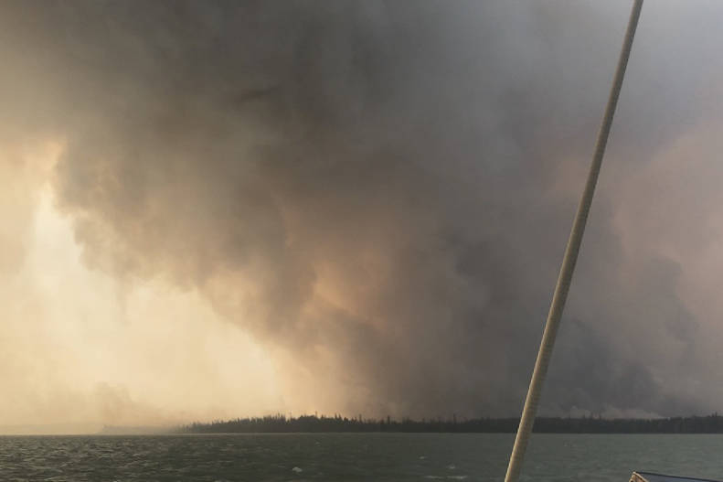 The Swan Lake Fire can be seen here from Skilak Lake on Aug. 19, 2019. (Photo courtesy Marissa Nunooruk)