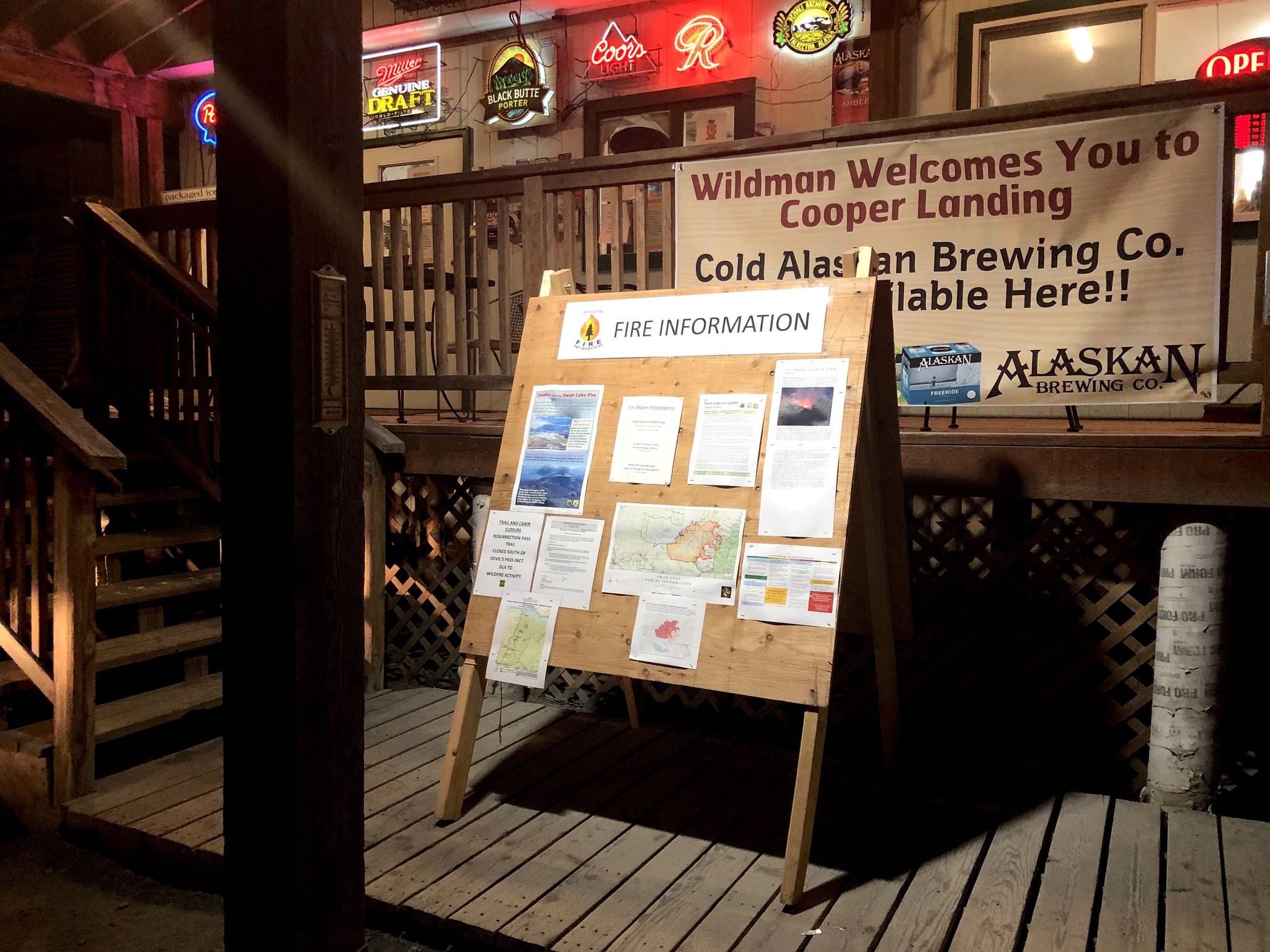 Fire information is posted outside of Wildmans in Cooper Landing on Aug. 19, 2019. (Photo by Victoria Petersen/Peninsula Clarion)