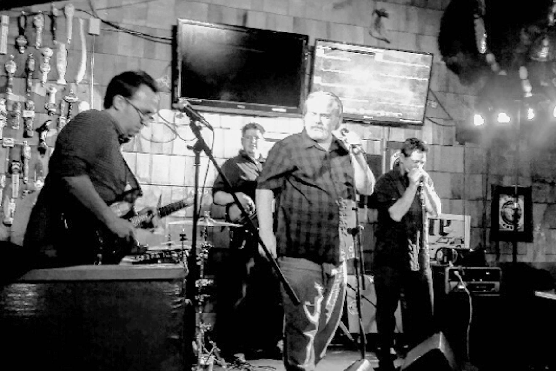 Members of The Rebel Blues Band perform at a recent gig in Anchorage. (Photo by Tasha Skolnick)