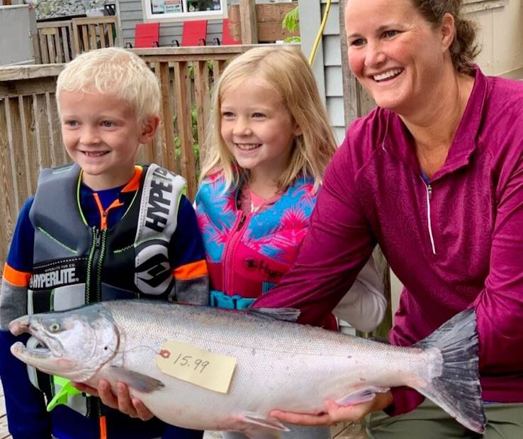 Seward Chamber of Commerce                                Michelle Murray, of Eagle River, and her two children show off the 2019 Seward Silver Salmon Derby winning fish caught at the head of Resurrection Bay on the F/V Joe Legacy. Murray took home a $10,000 prize for largest fish.