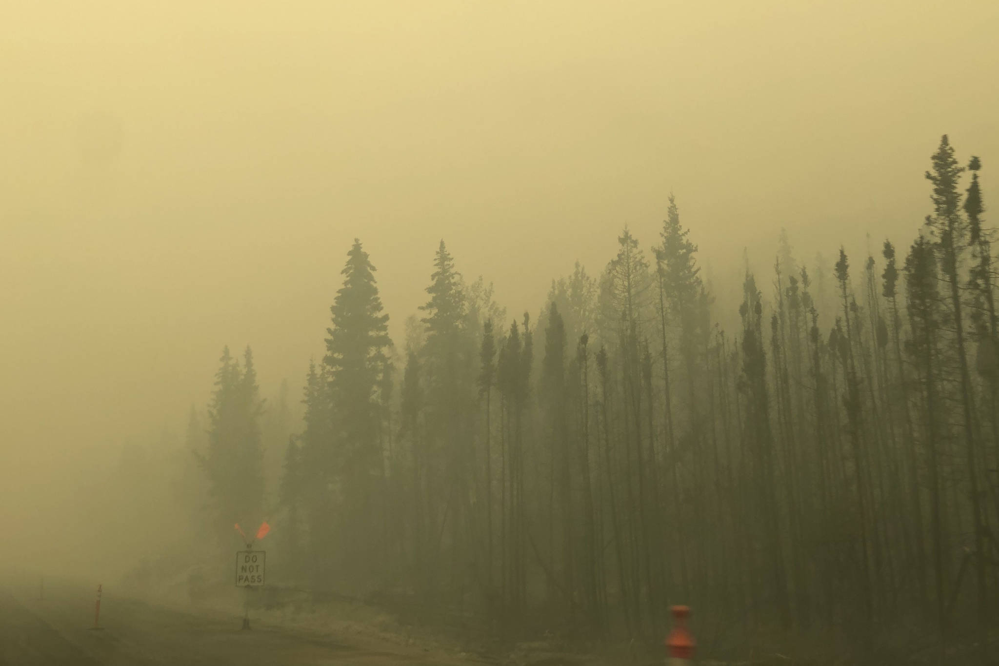 Smoke from the Swan Lake Fire impairs visibility on the Sterling Highway on Aug. 20, 2019. (Photo by Victoria Petersen/Peninsula Clarion)