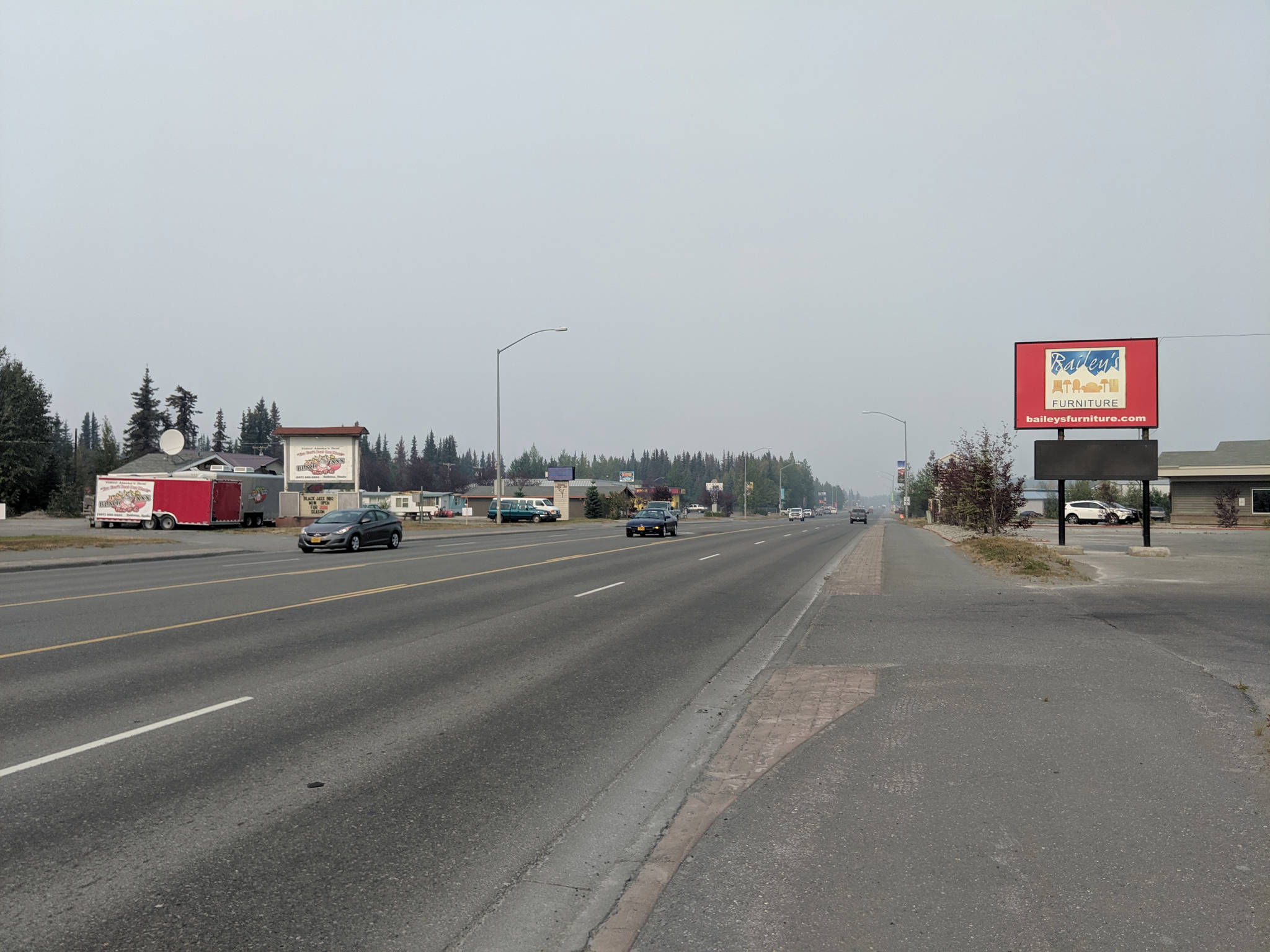Haze from the Swan Lake Fire smoke can be seen from the Kenai Spur Highway in Soldotna, Alaska, on Thursday, Aug. 22, 2019. Winds pushed smoke from the fire toward the central peninsula Thursday. (Photo by Erin Thompson/Peninsula Clarion)